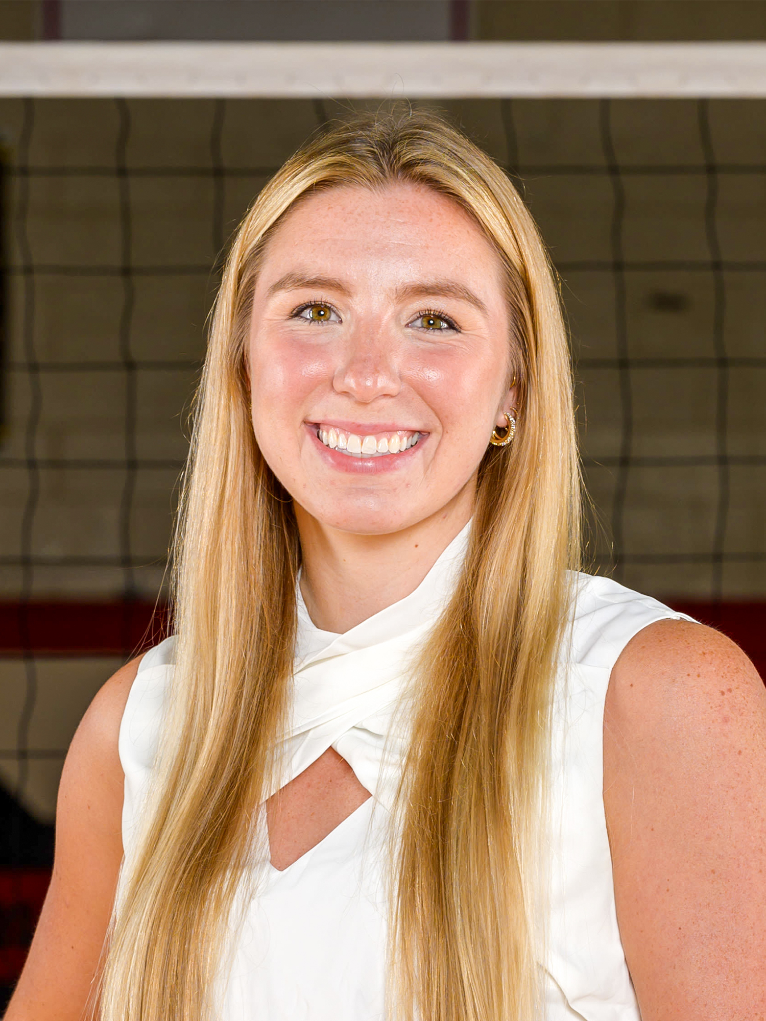 Headshot of Thayer Hall in a White shirt