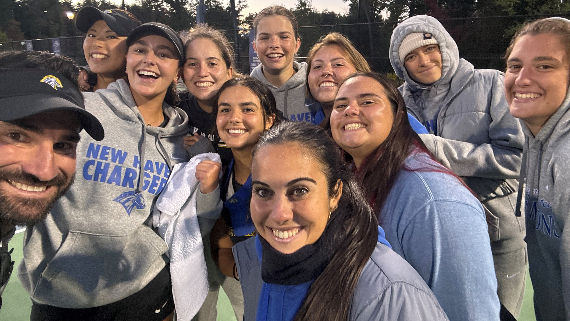 Women's Tennis Group Photo following SNHU Win to Secure 9-0 Undefeated Regular Season