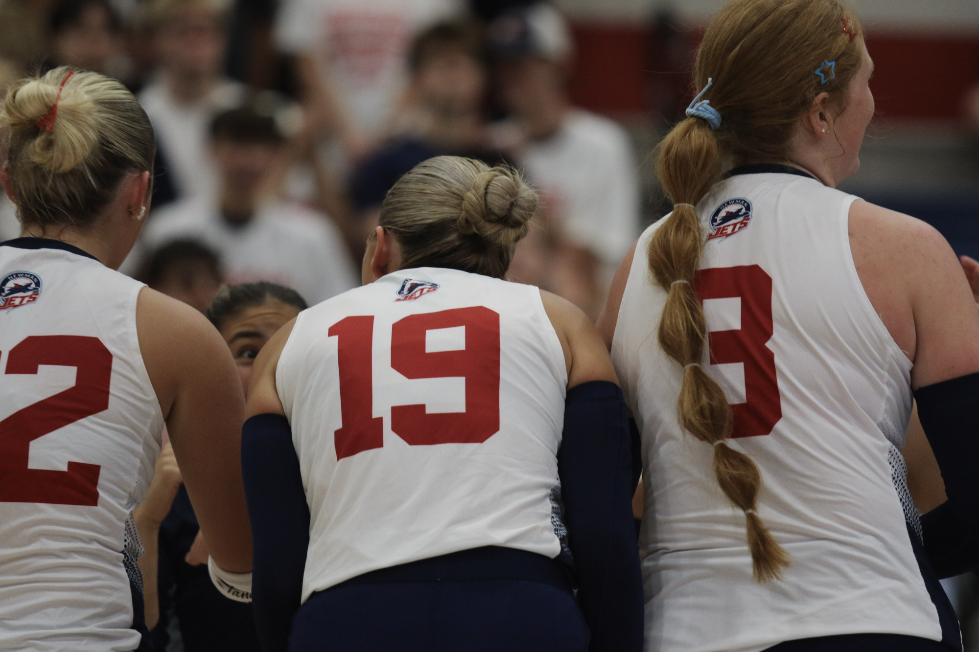 Newman Players in a huddle