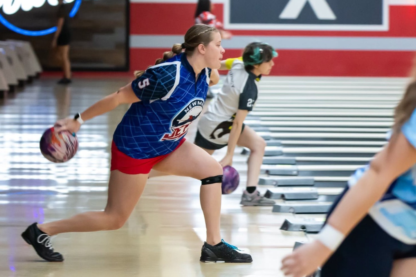 Women's bowling in action