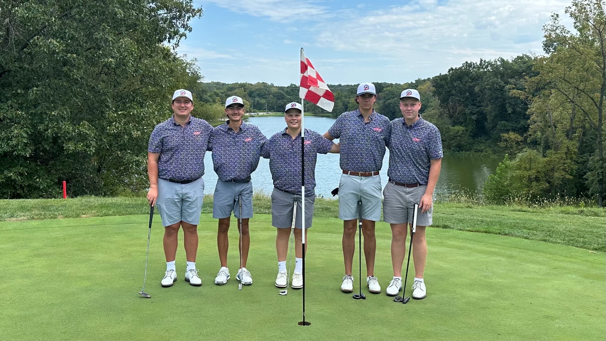 Men's Golf team poses for a picture on the green in Warrensburg