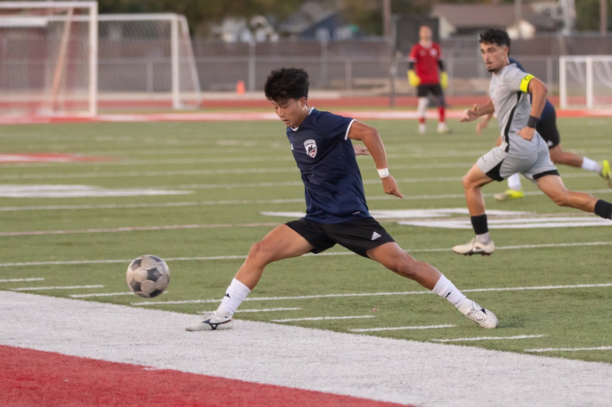 Okada plays the ball ahead