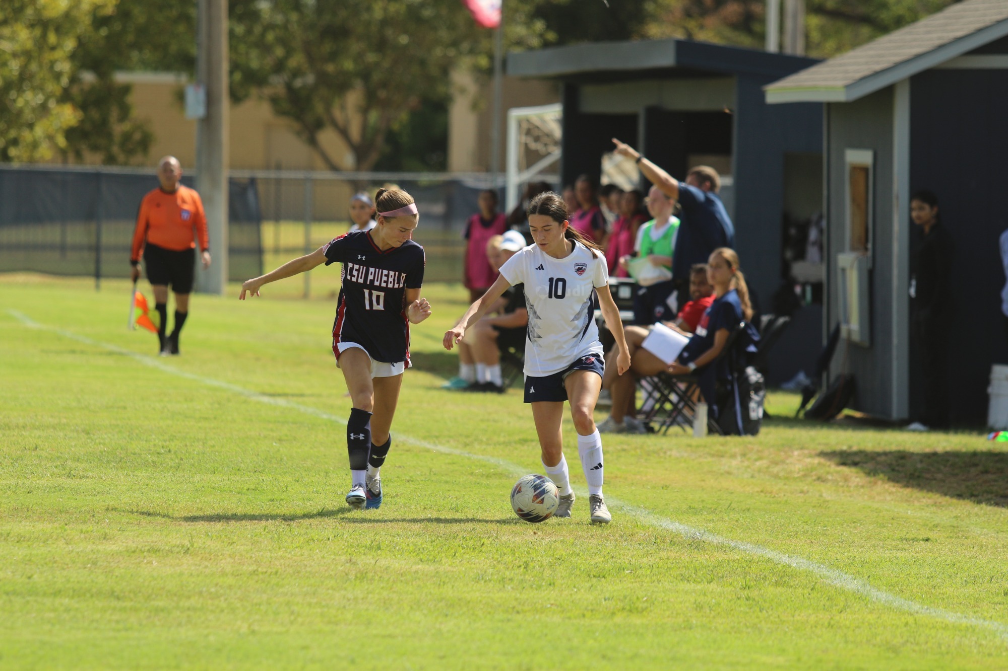 Izzy Sandoval rushes up the sideline with possession of the ball vs CSU Pueblo
