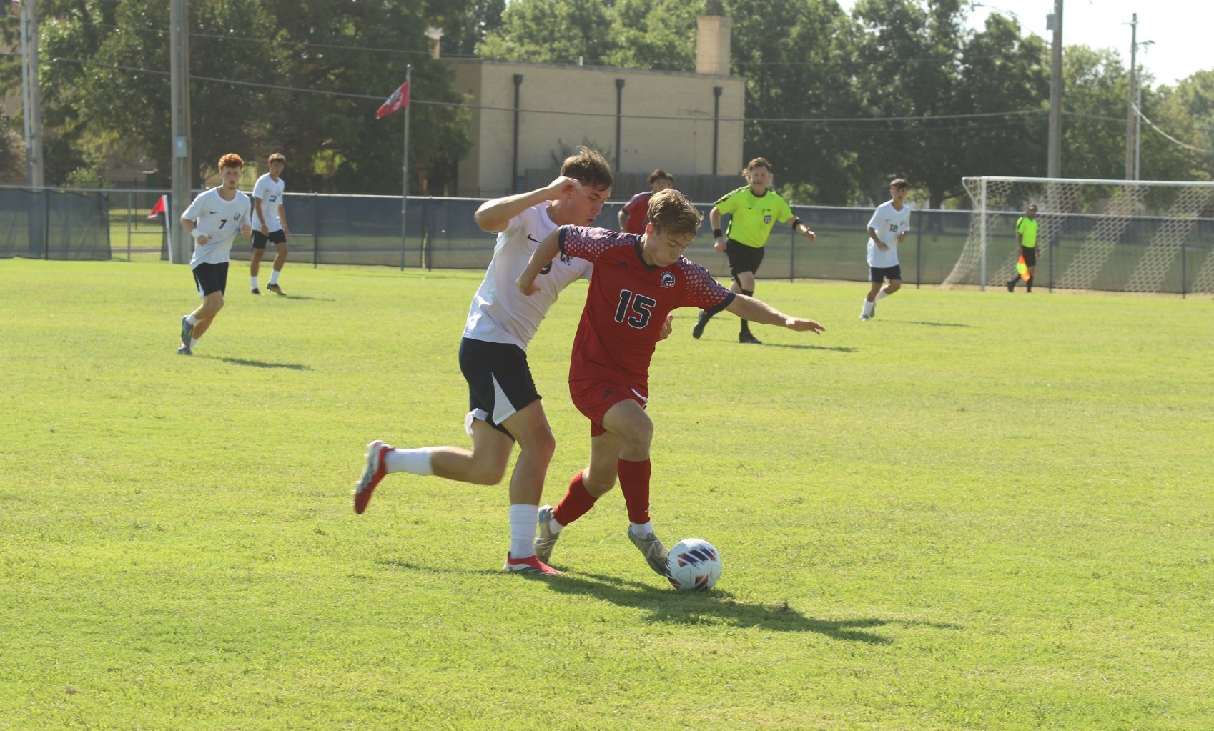 Vincent Edgell pushes teh ball up field against a Hillcat challenge