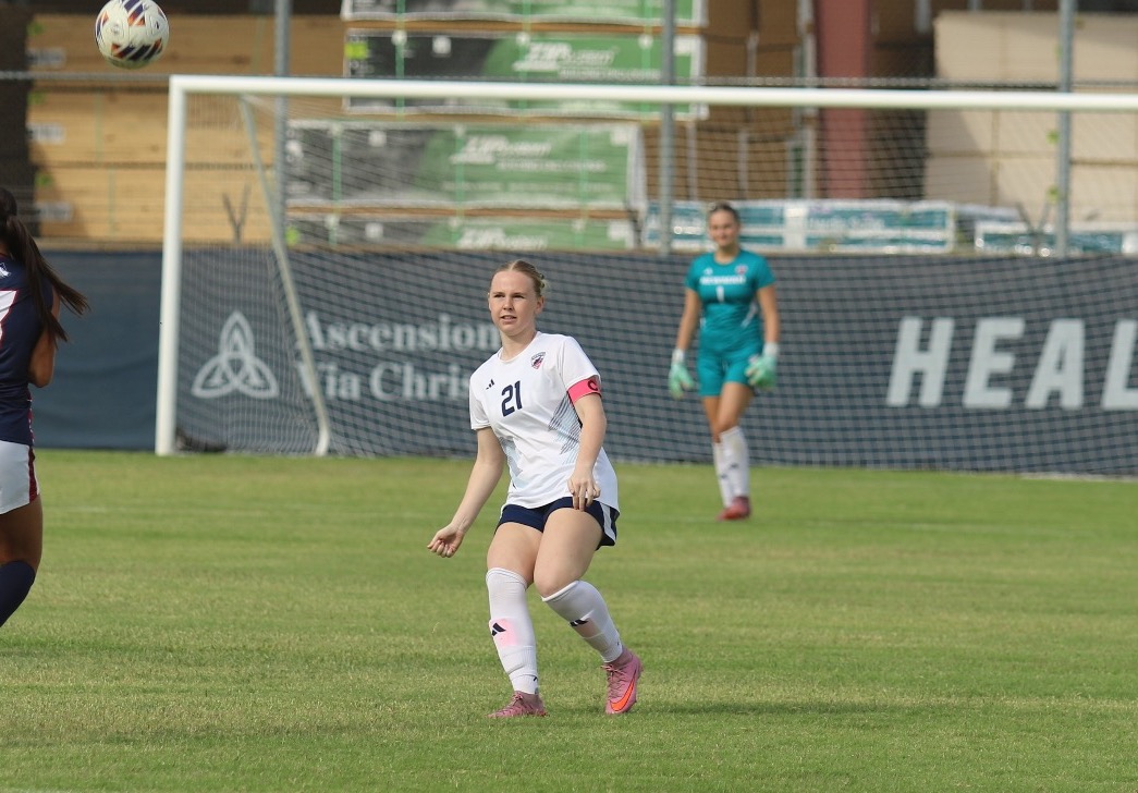 Grace Long moves into position to challenge for the ball