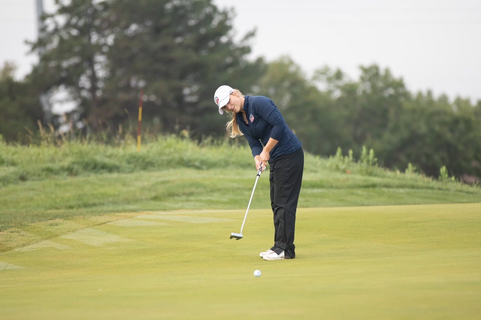 Mikaela Stenborg putting on a green
