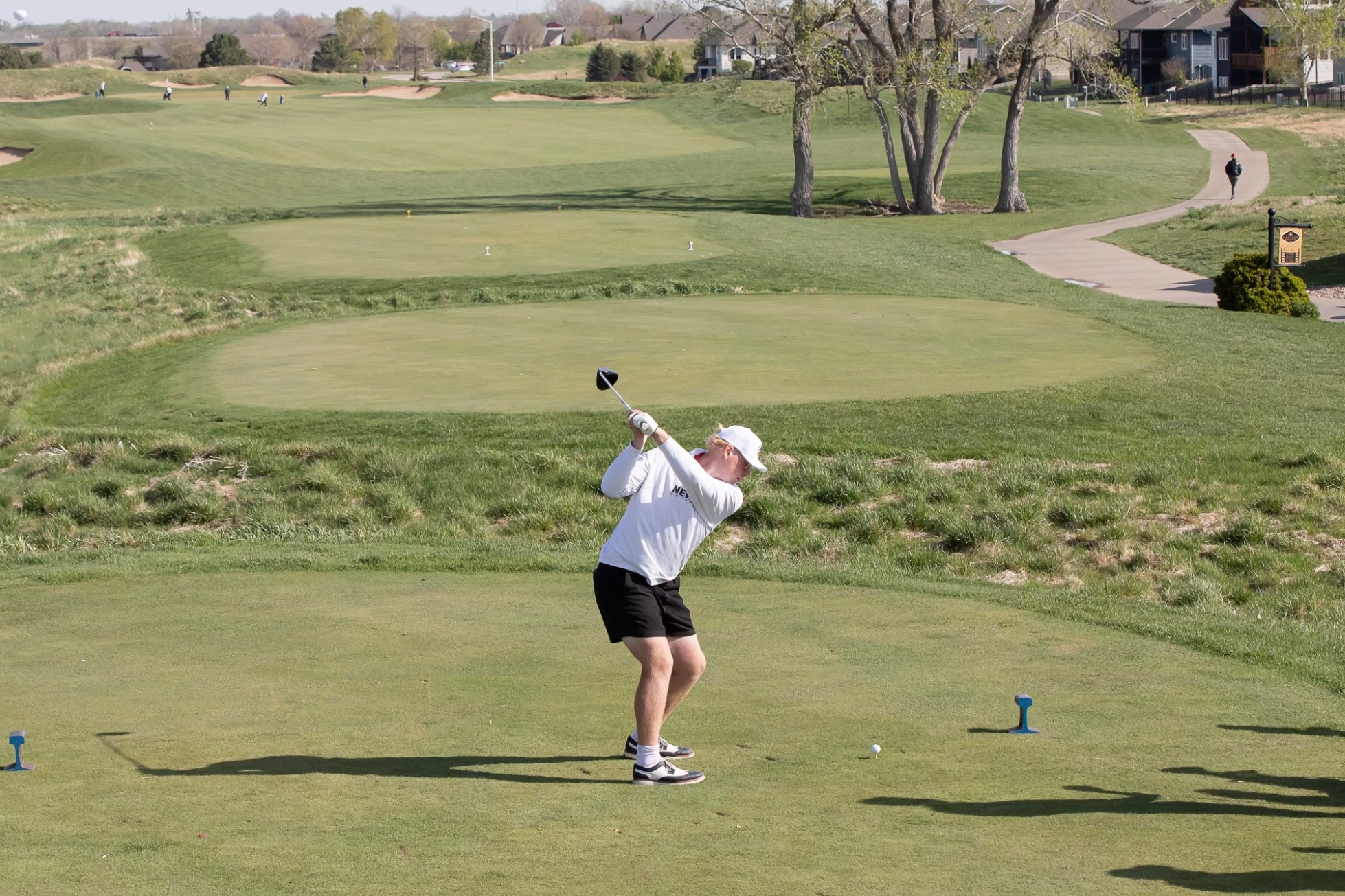 Newman golfer preparing to swing on a drive