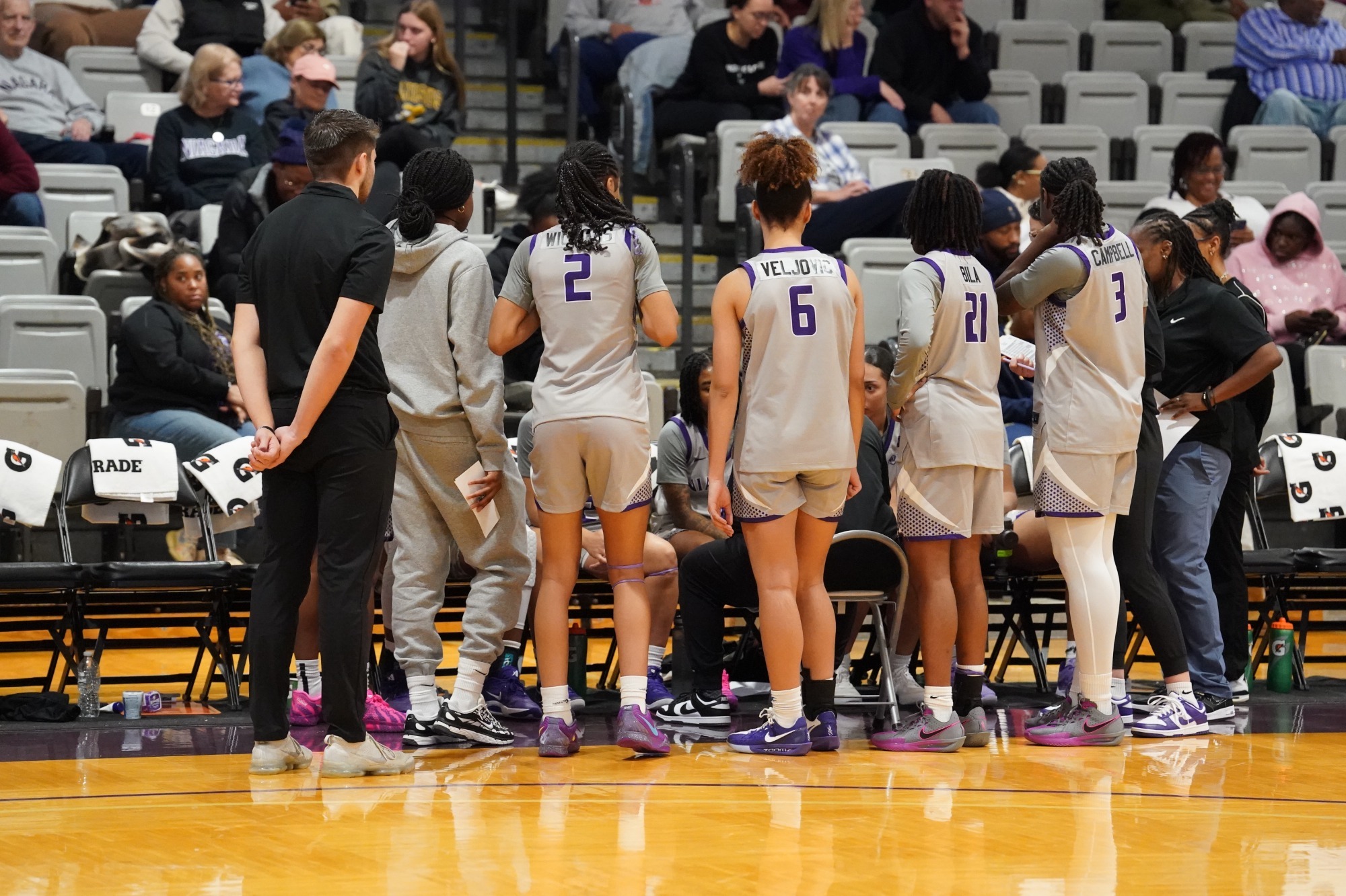 Women's Basketball huddle against Fordham on 11/26