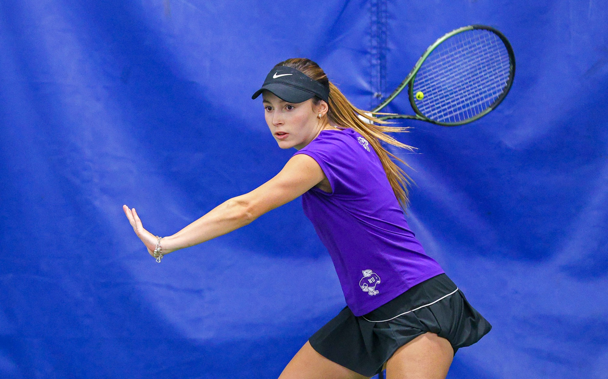 Niagara's Valeria Mora  during her doubles match  against Penn State during their women's tennis match on Feb. 8, 2025.  Photo/Craig Houtz