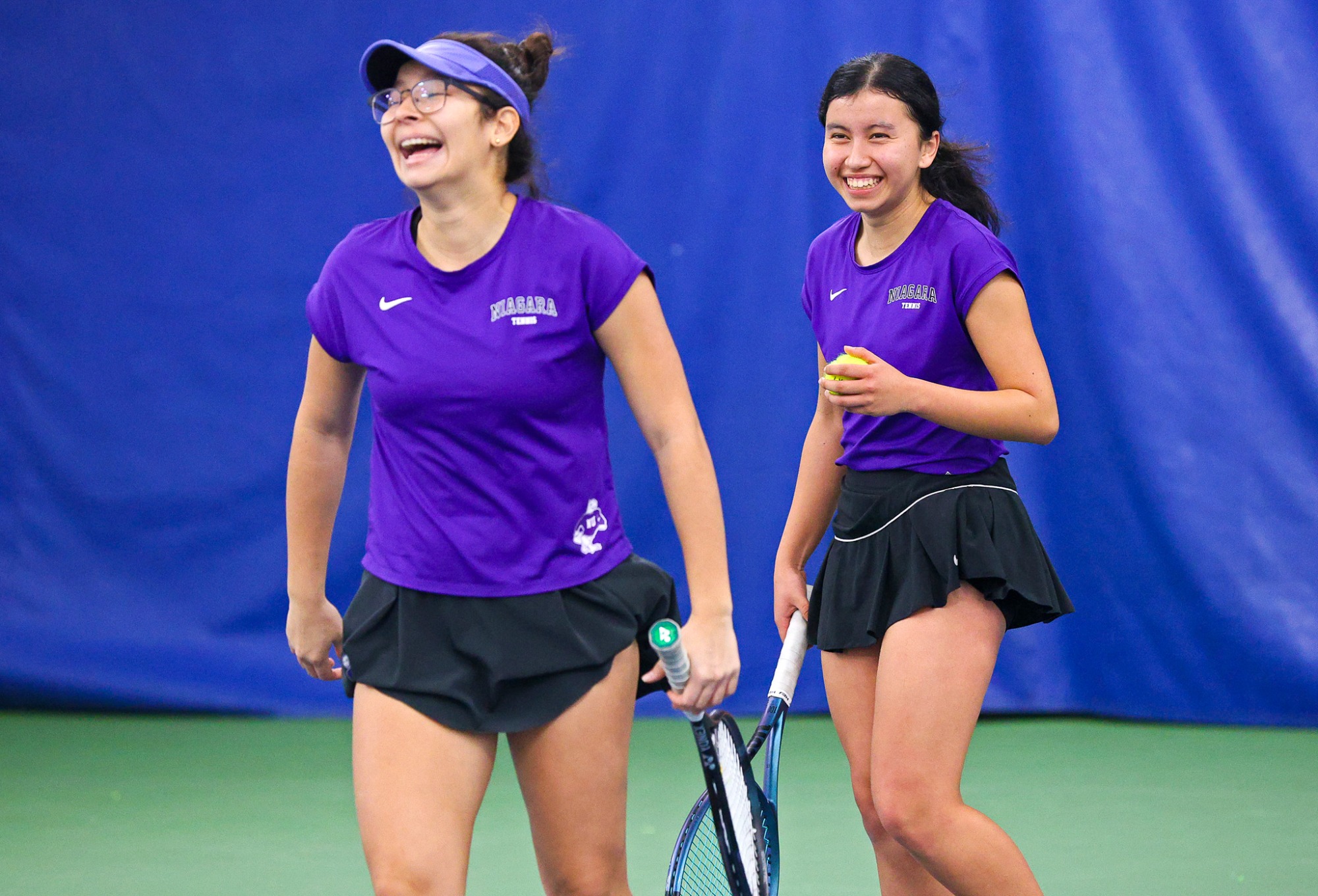 Niagara's  Isabel Garcia, right, and Gabriela Melo, left, during their doubles match  against Penn State during their women's tennis match on Feb. 8, 2025.  Photo/Craig Houtz