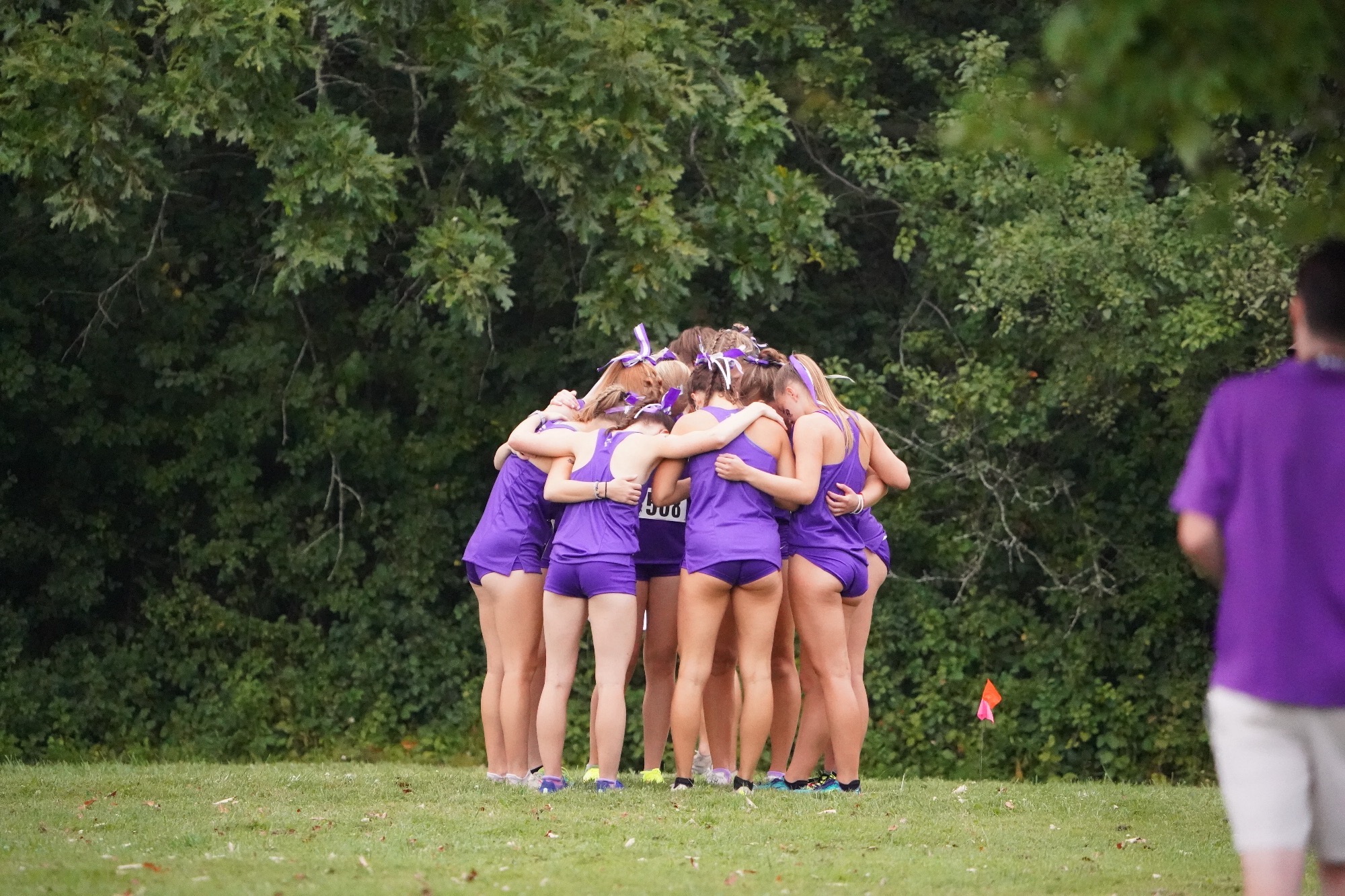 XC huddles at the 2024 Little Three