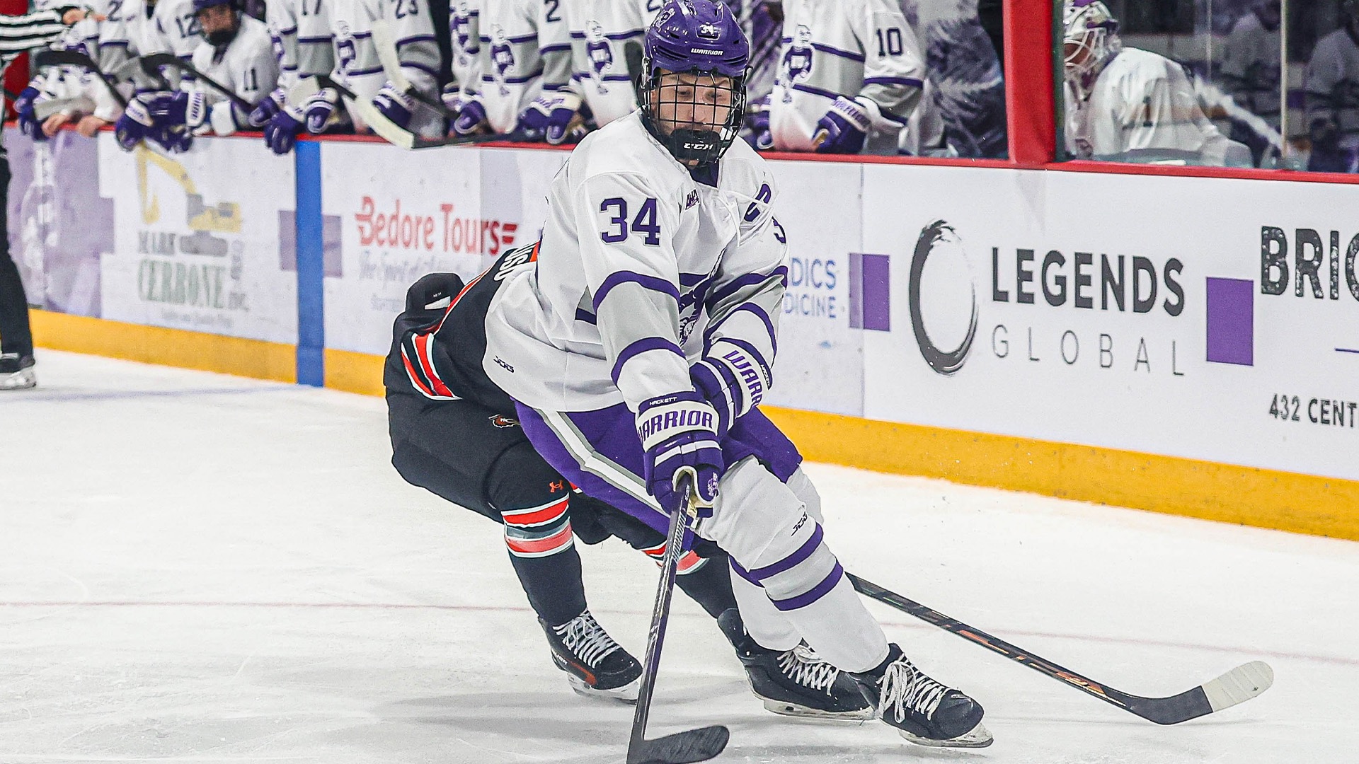 Noah Hackett Battles for the Puck Against RIT 2026
