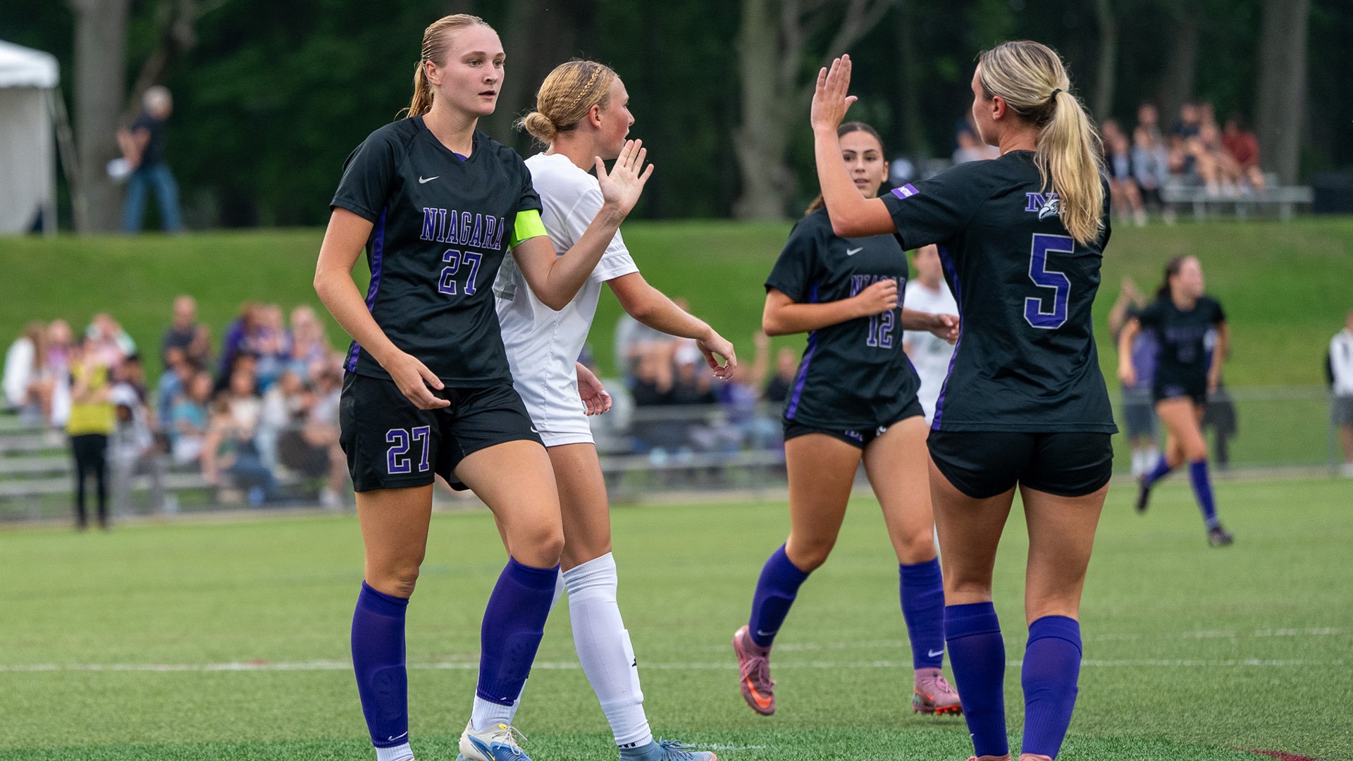 Caitlyn Gratton high fives Angelina Kristic at SBU on 8/31