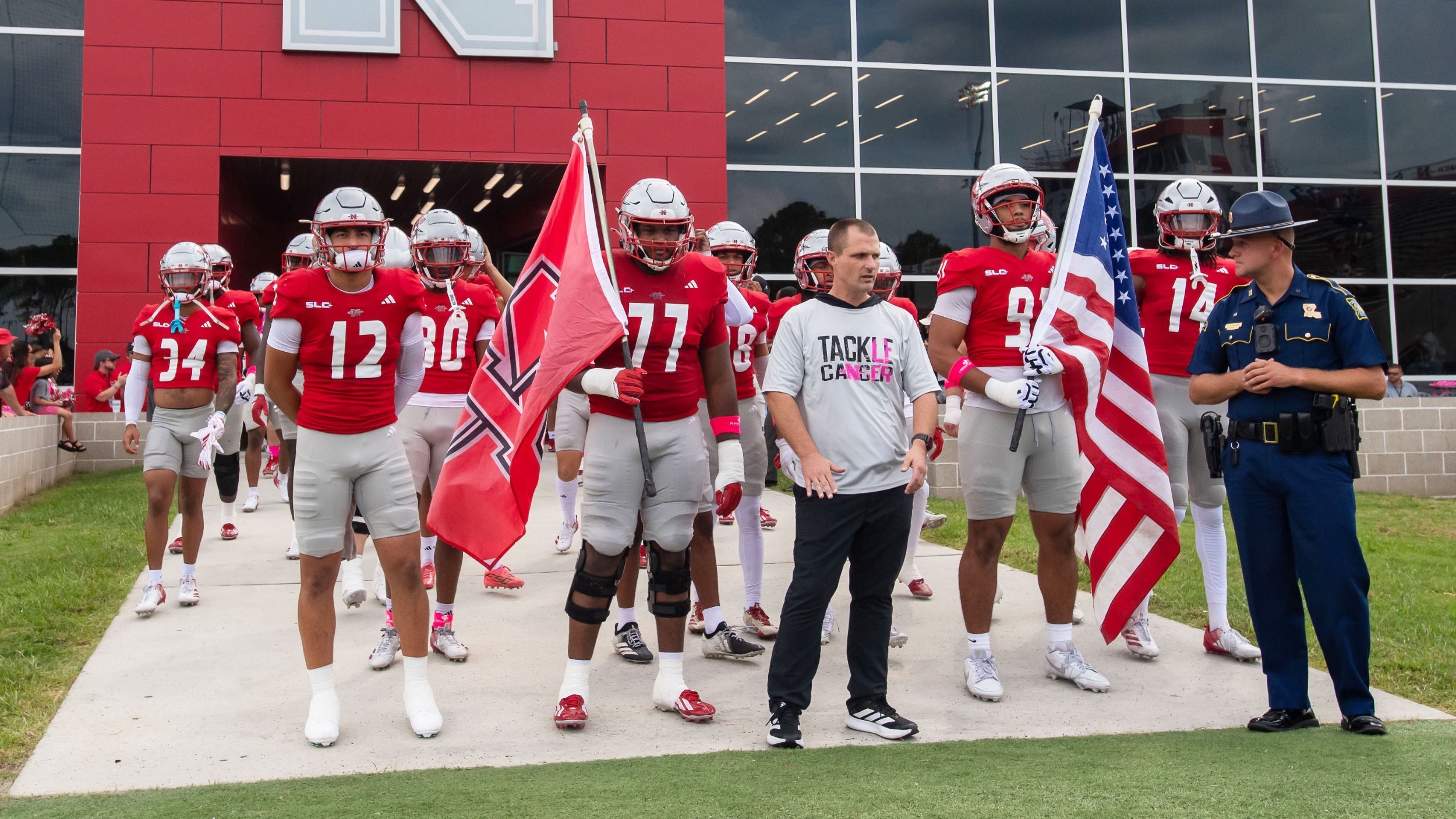 The Nicholls Football team exits the team locker room before kickoff