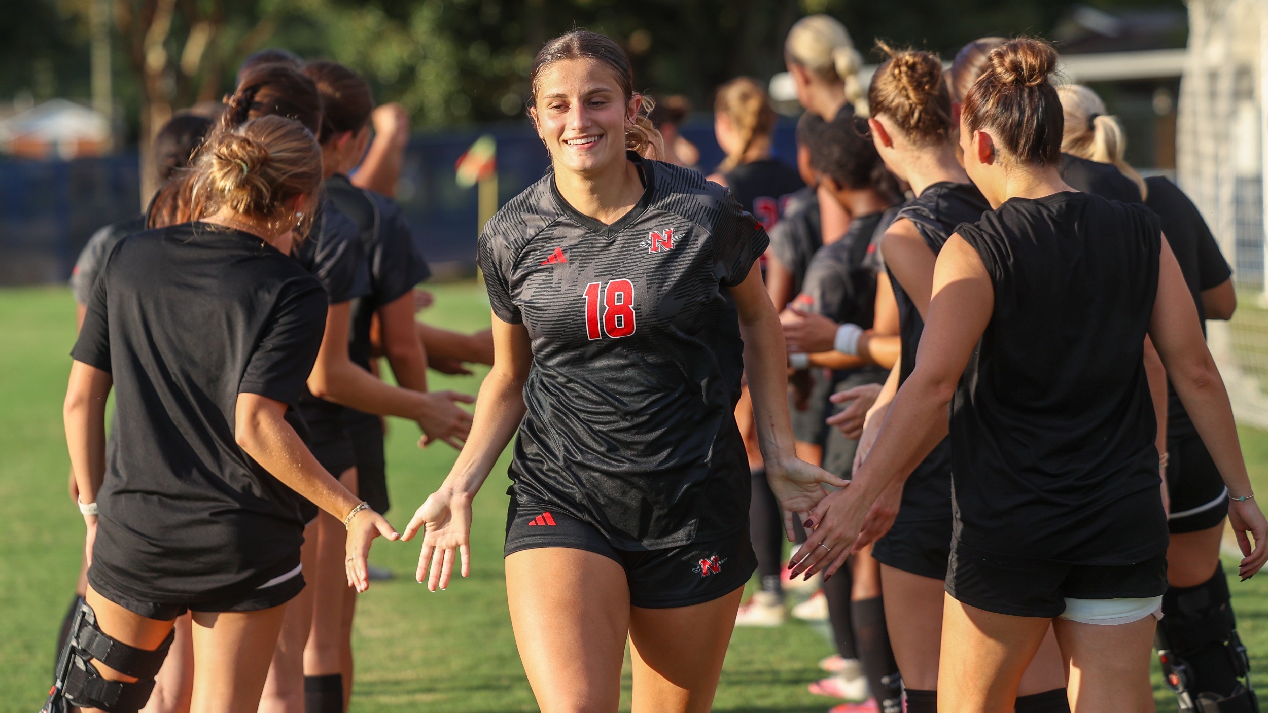 Jezlyn Nelson smiles during starting lineups 