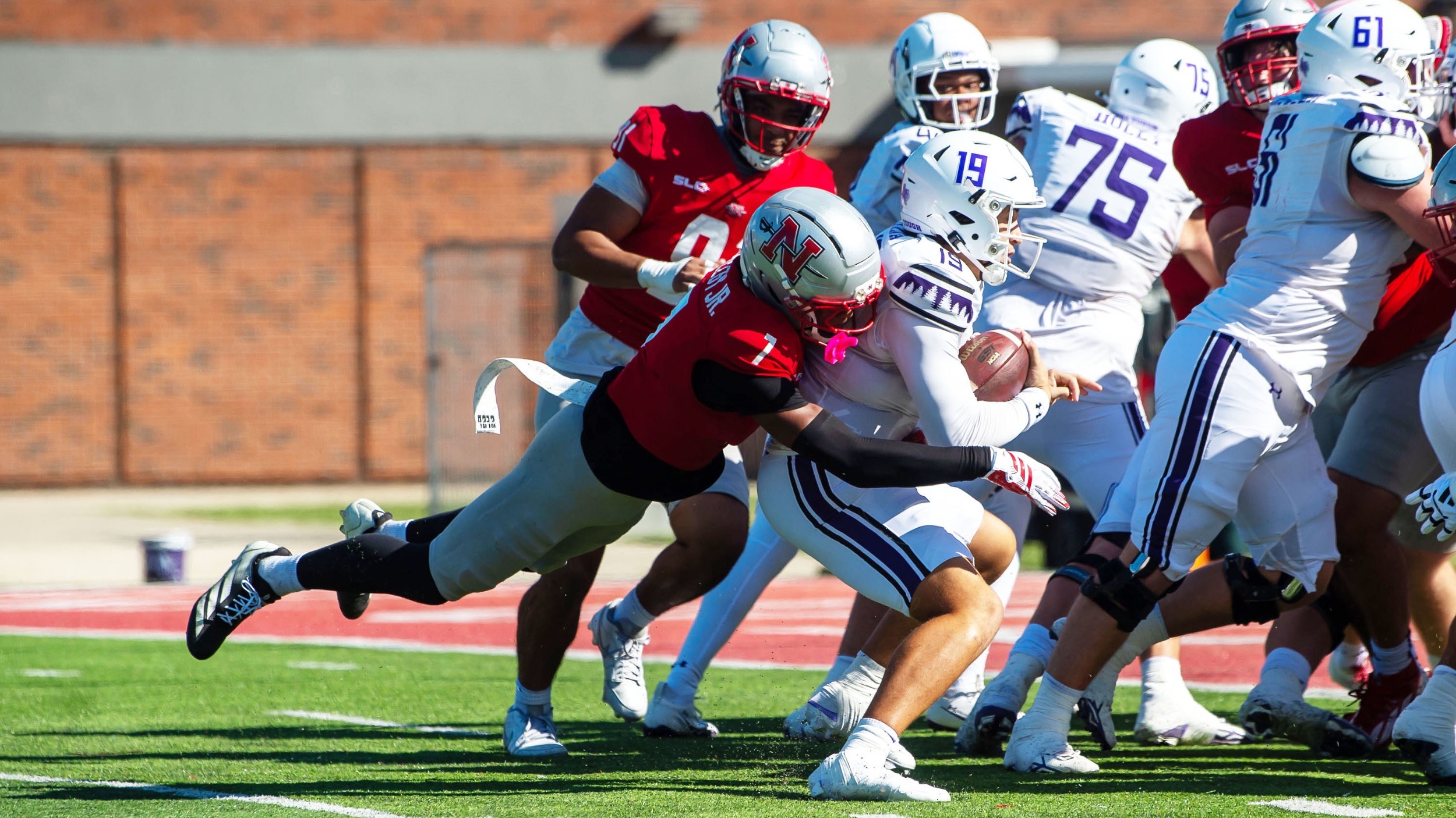 Jhamal Shelby Jr. makes a tackle against SFA