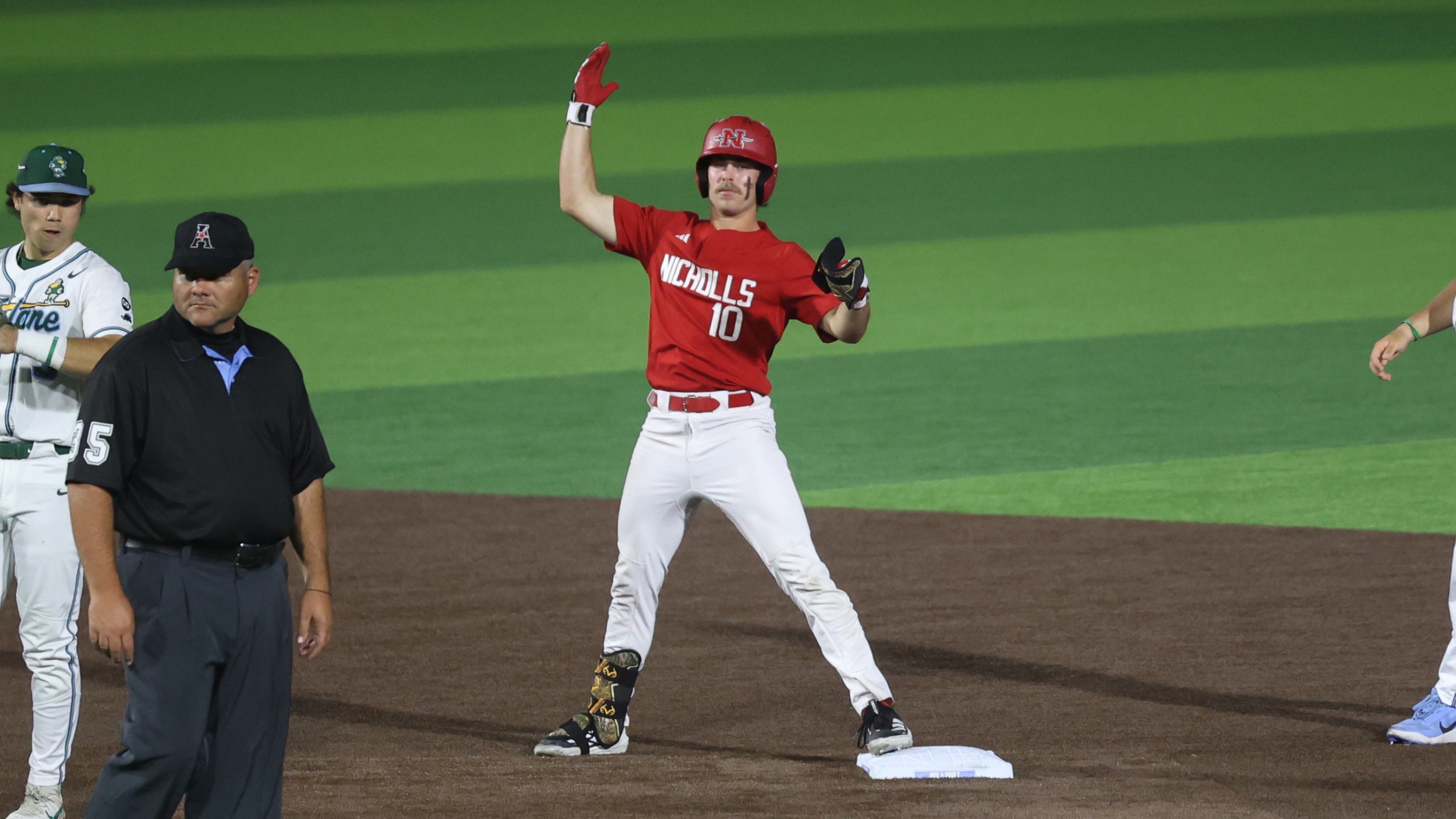 Jaxon Milam celebrates on second base in the Nicholls vs Tulane baseball game