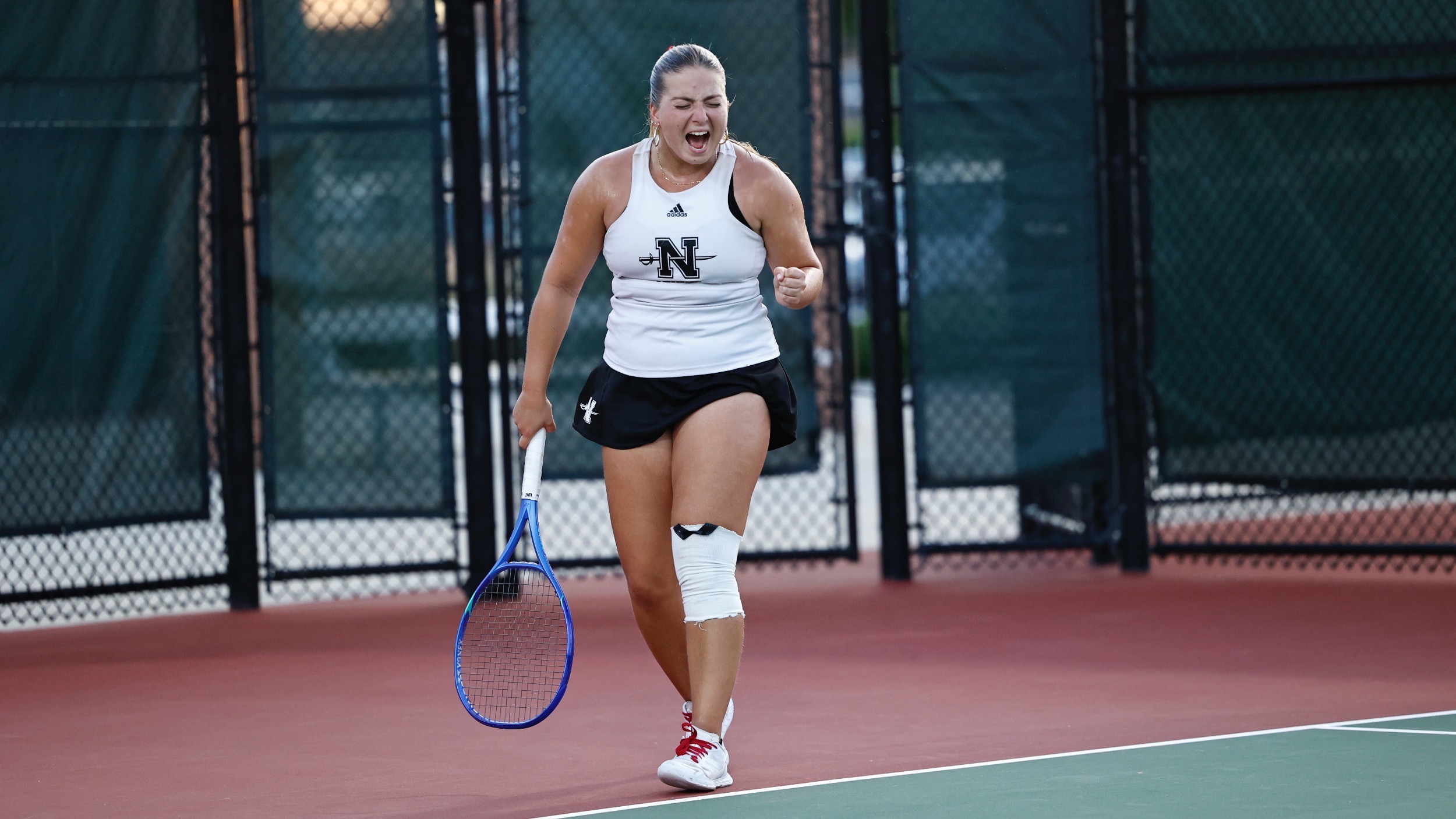 Blanca Losada celebrates a point for Nicholls tennis