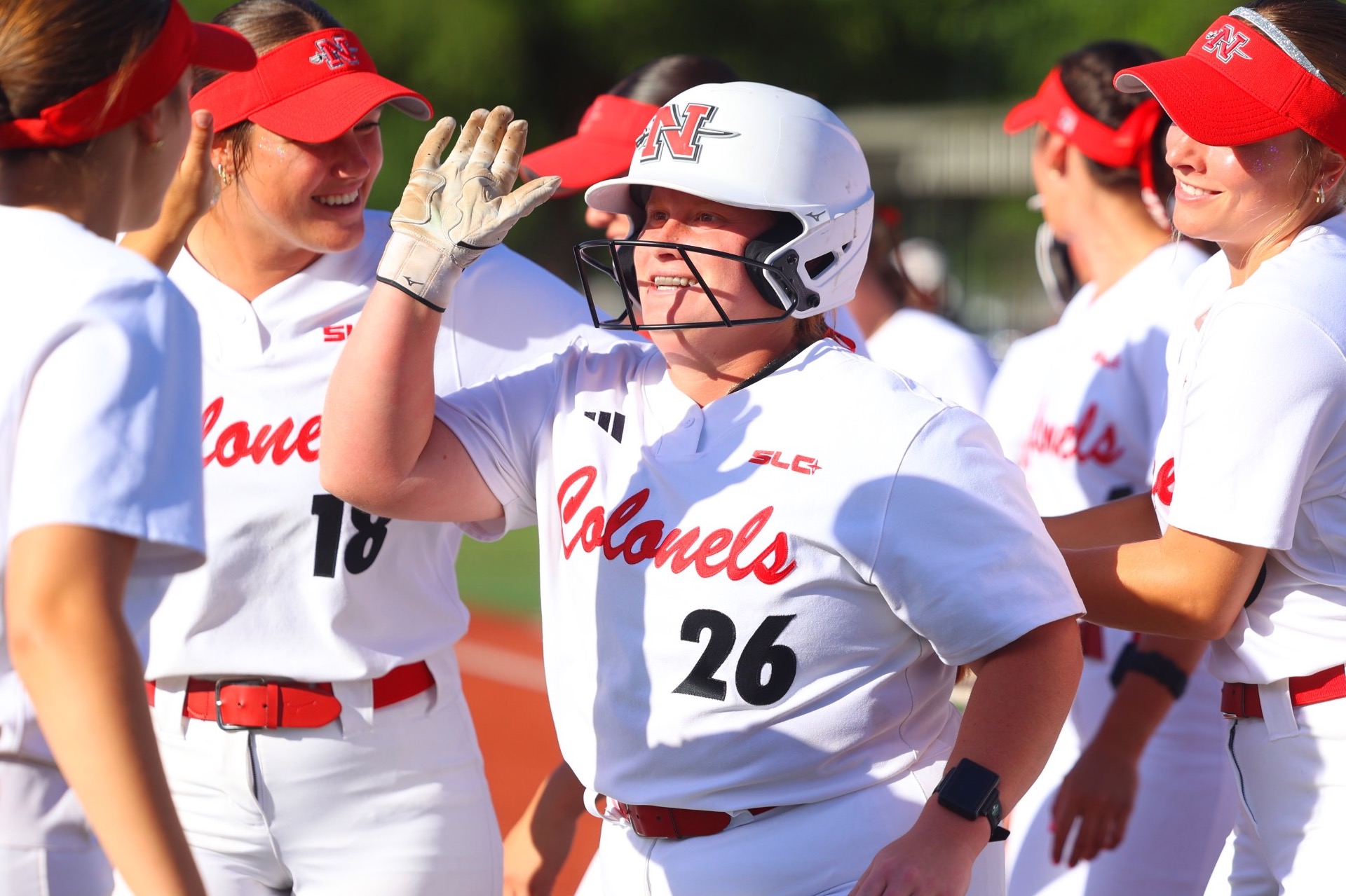 Brynne Songy celebrates after hitting a home run