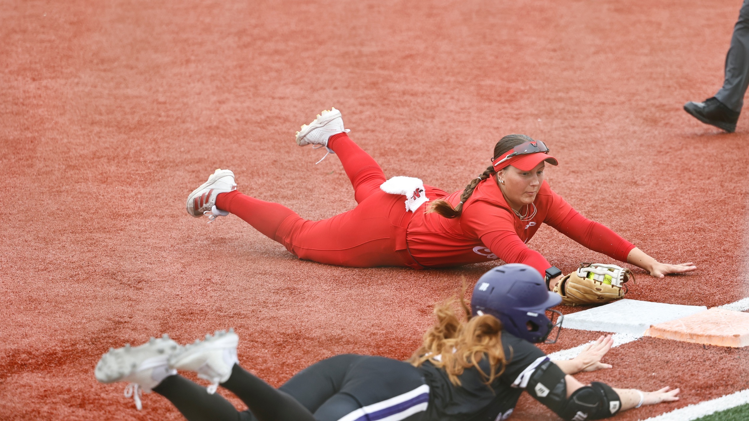 Gabby Higbee dives to first base 