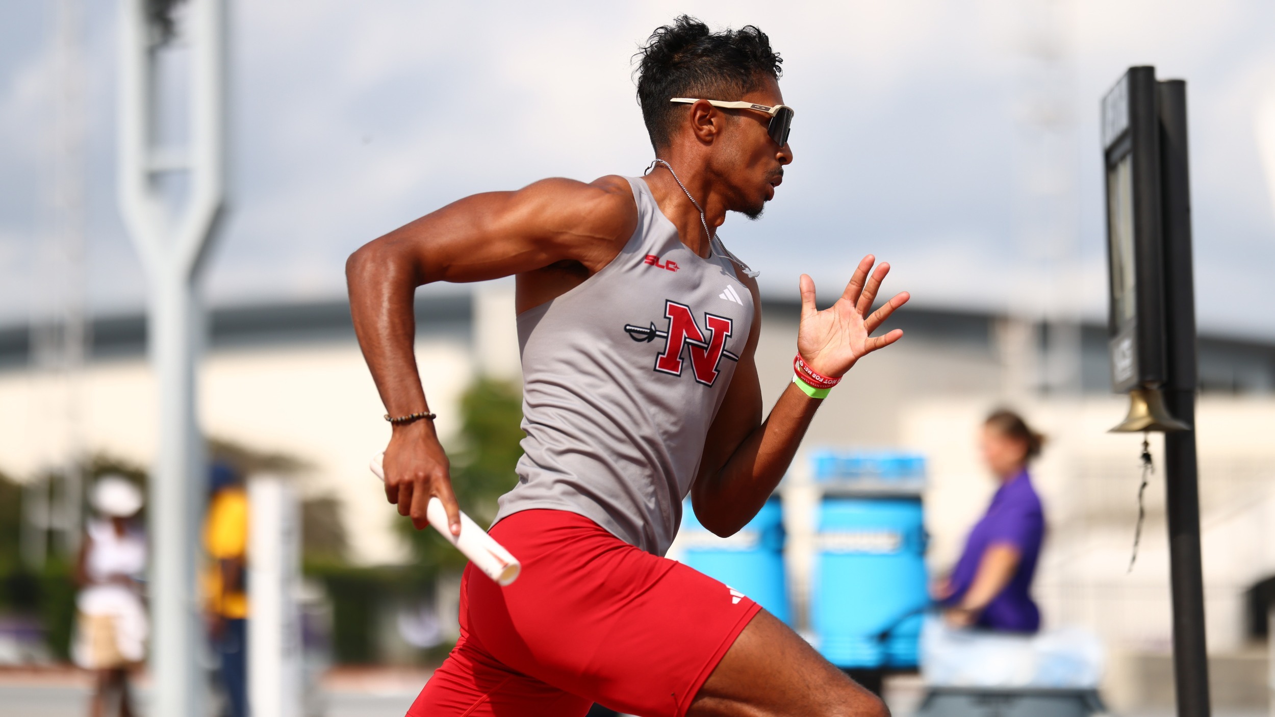 Trent Grandberry runs  relay race at LSU track meet