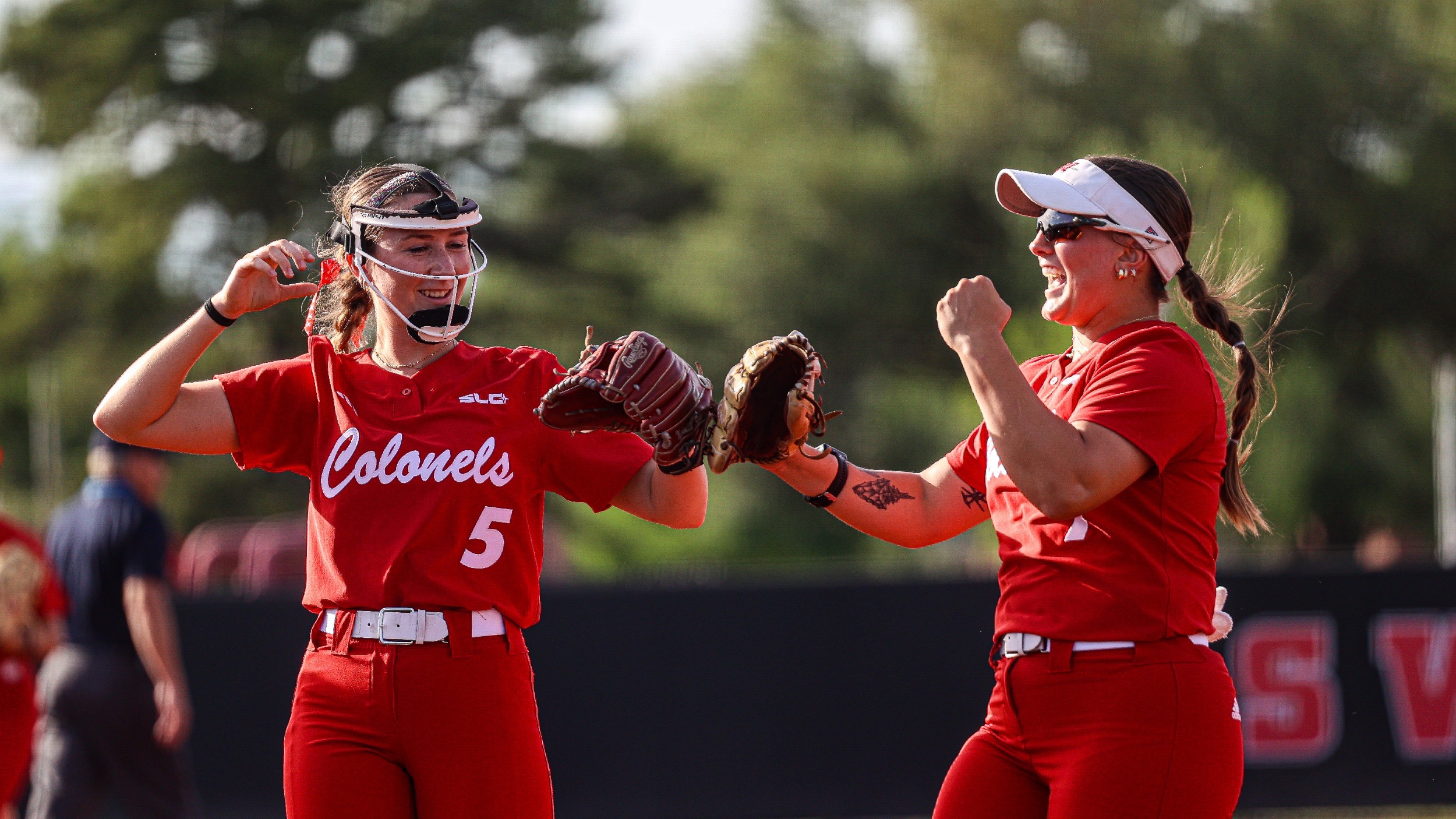 Erin Krause  and Gabby Higbee celebrate after a big play for Nicholls softball