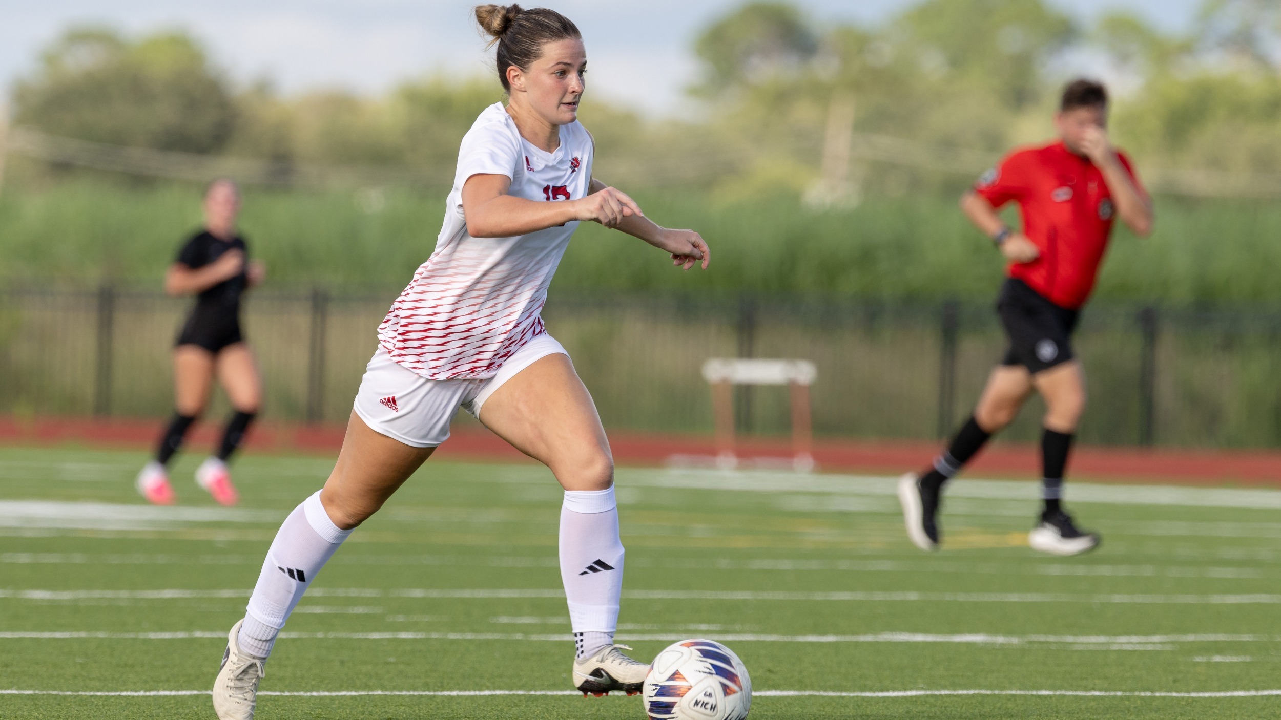 Kaylie Harris Dribbles in Home Match
