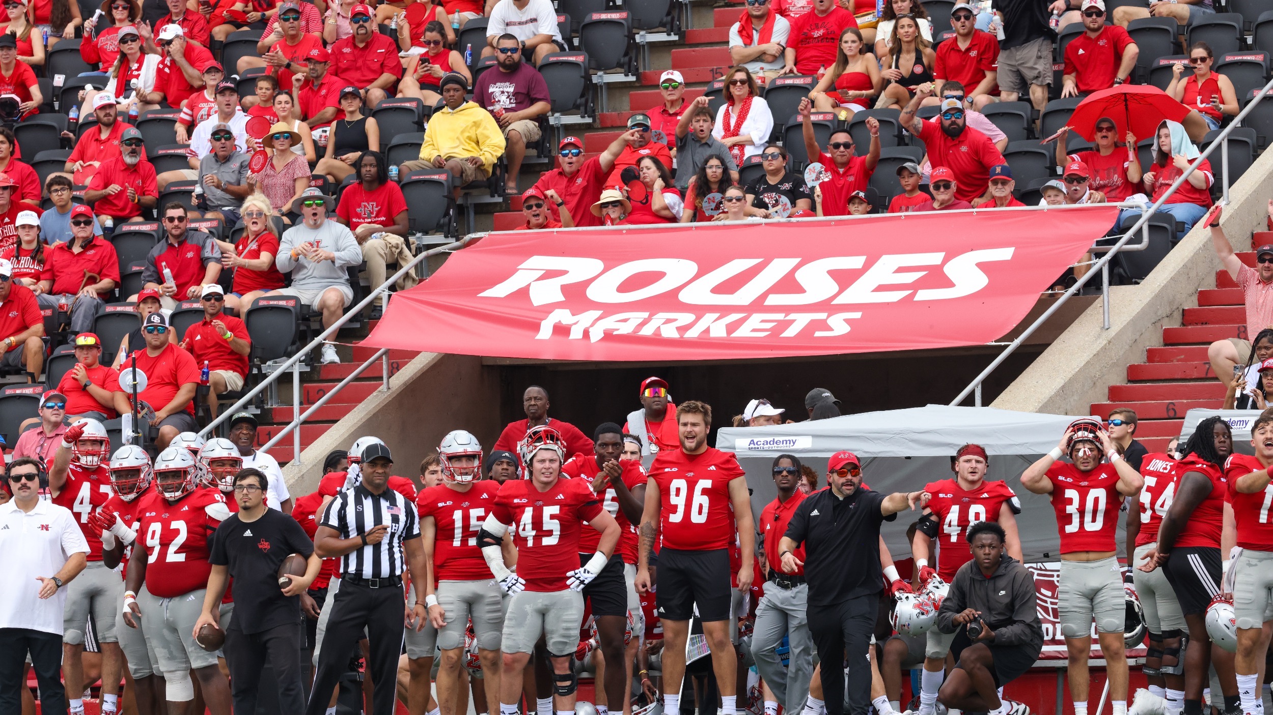 Colonel football sidelines with the crowd in the background
