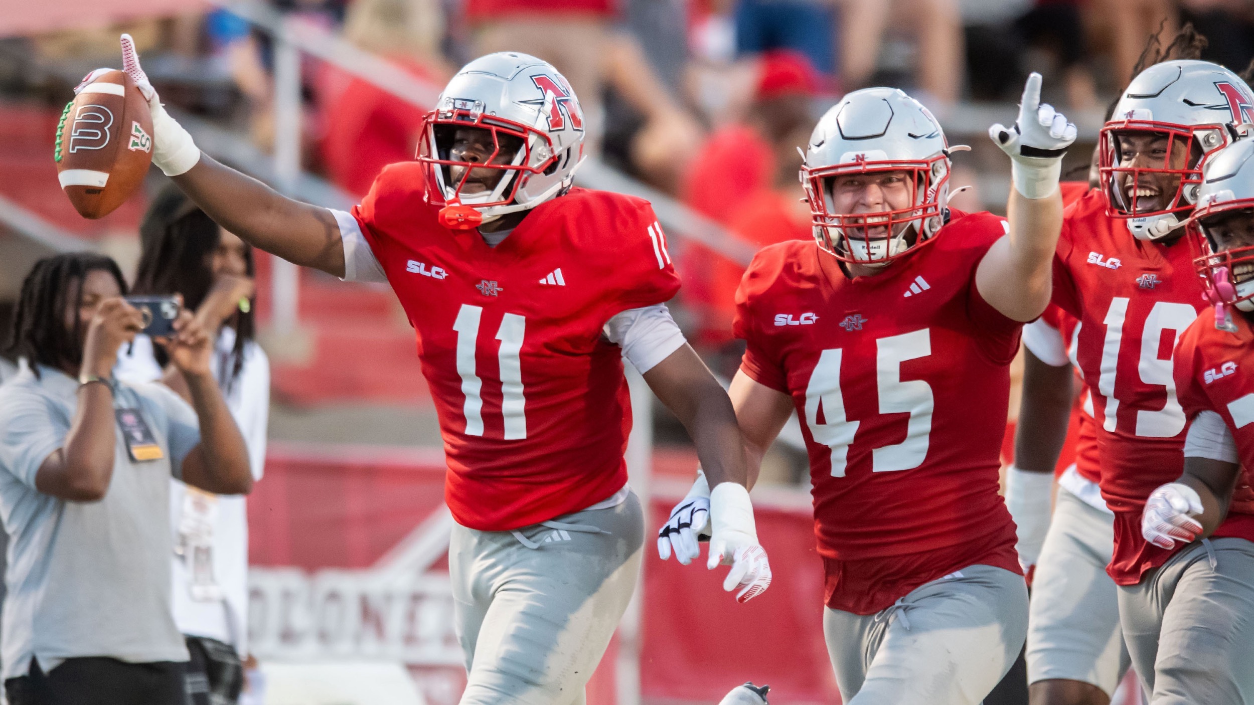 Antoine Okelo-Johnson and Alex Villavaso celebrate for Nicholls football following a turnover