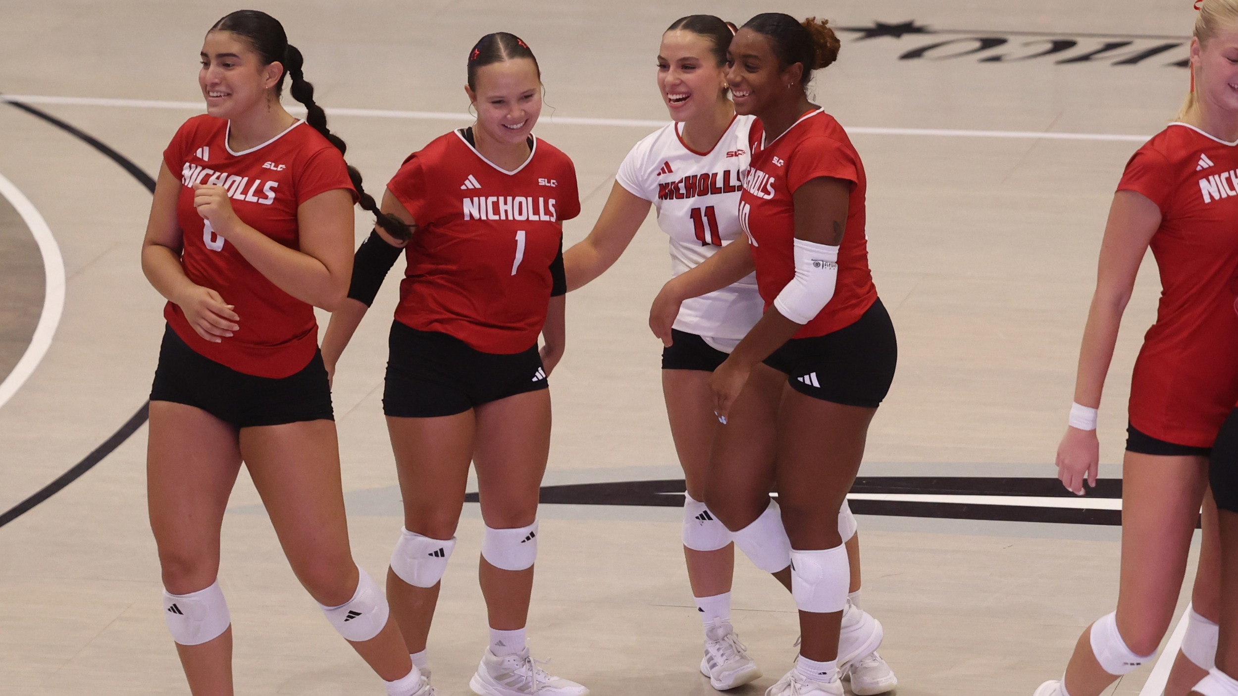 Lizzie Kraft, Tierney Terrell, Isabella Padilla, and Natalia Navarro celebrate a point during a volleyball match