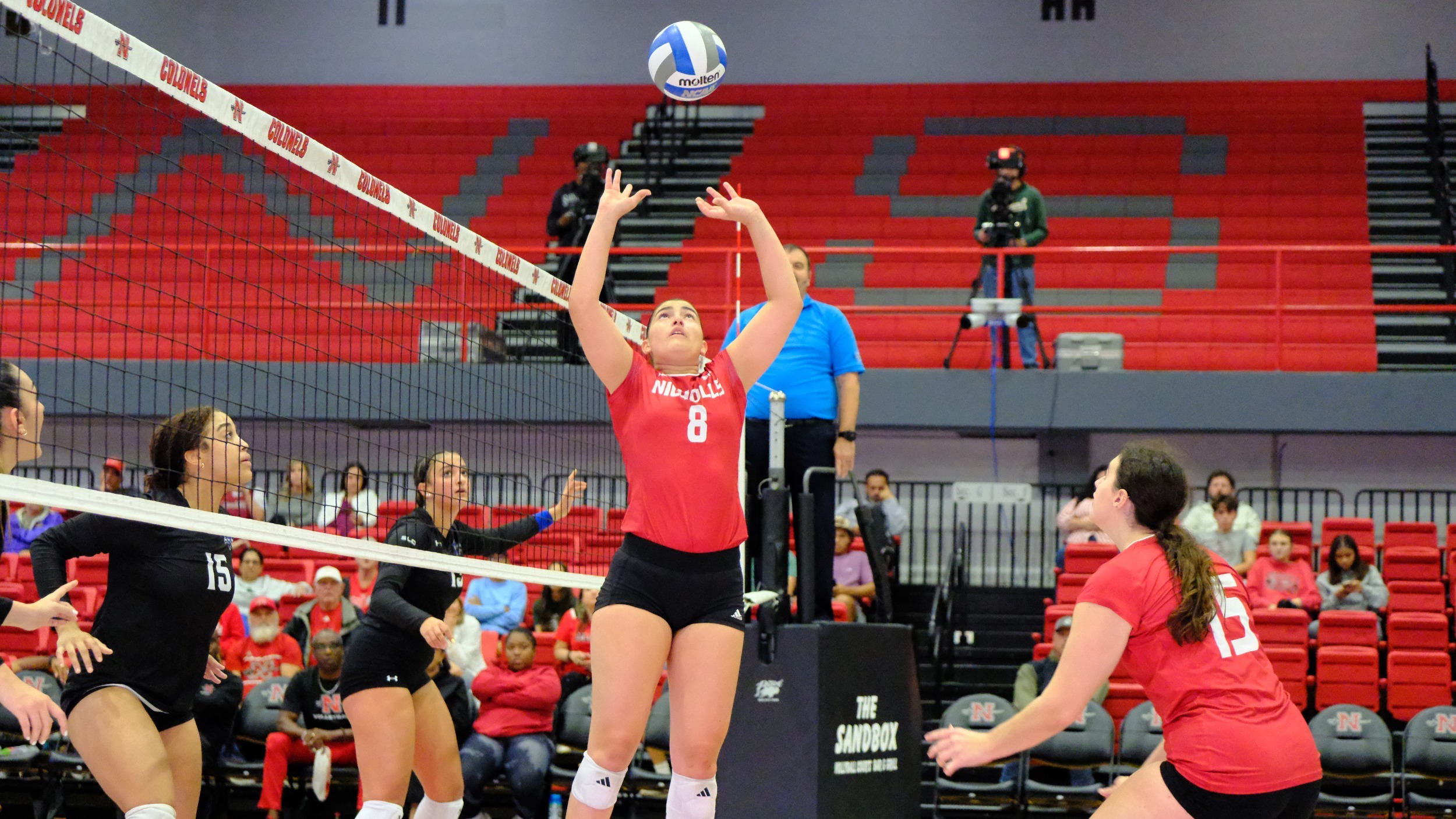 Isabella Padilla passes during nicholls volleyball match