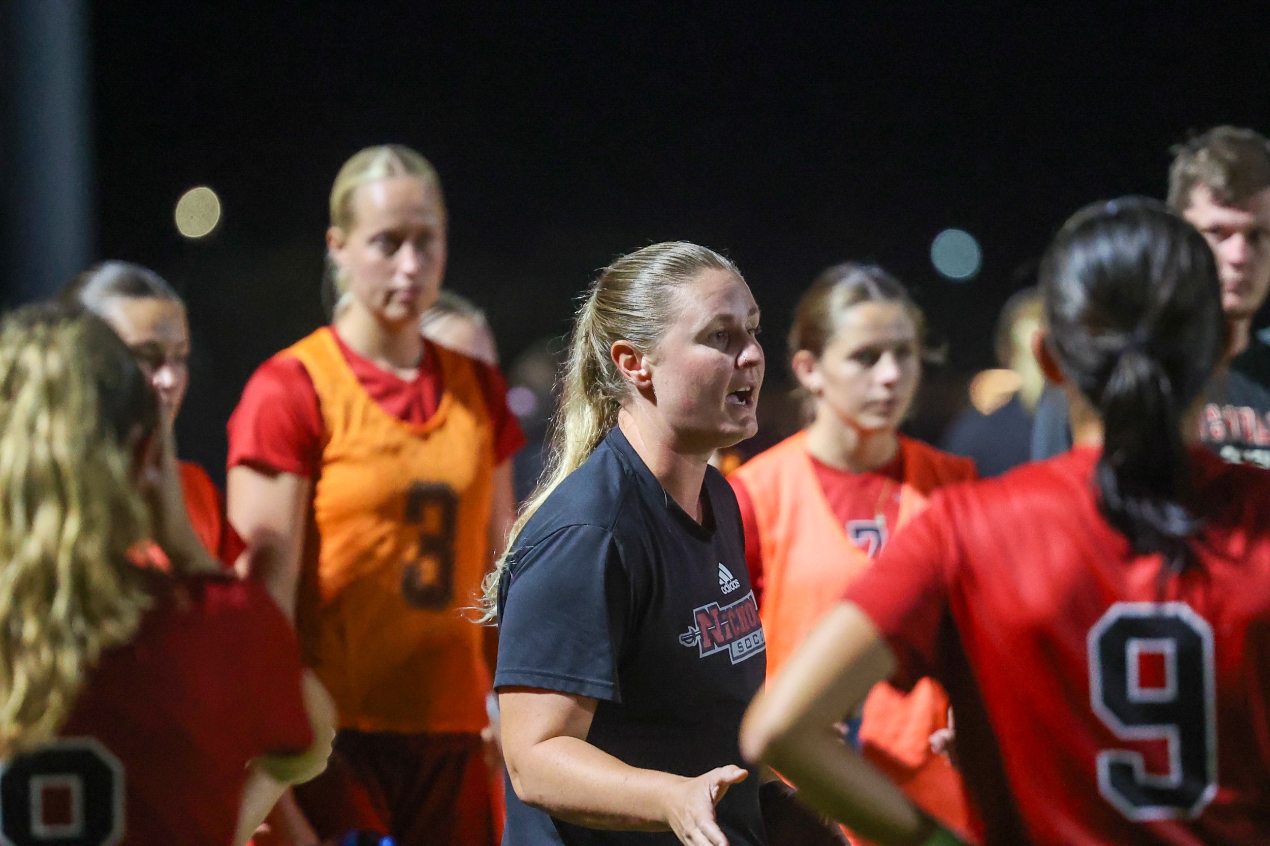 Nicholls Soccer coach Kristy Helmers addresses the team during a match 