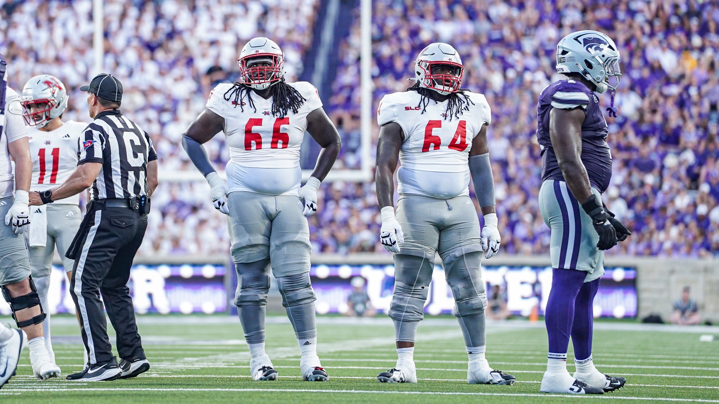 Offensive linemen Kamron and Kyron Barnes prep for a play for Nicholls Football