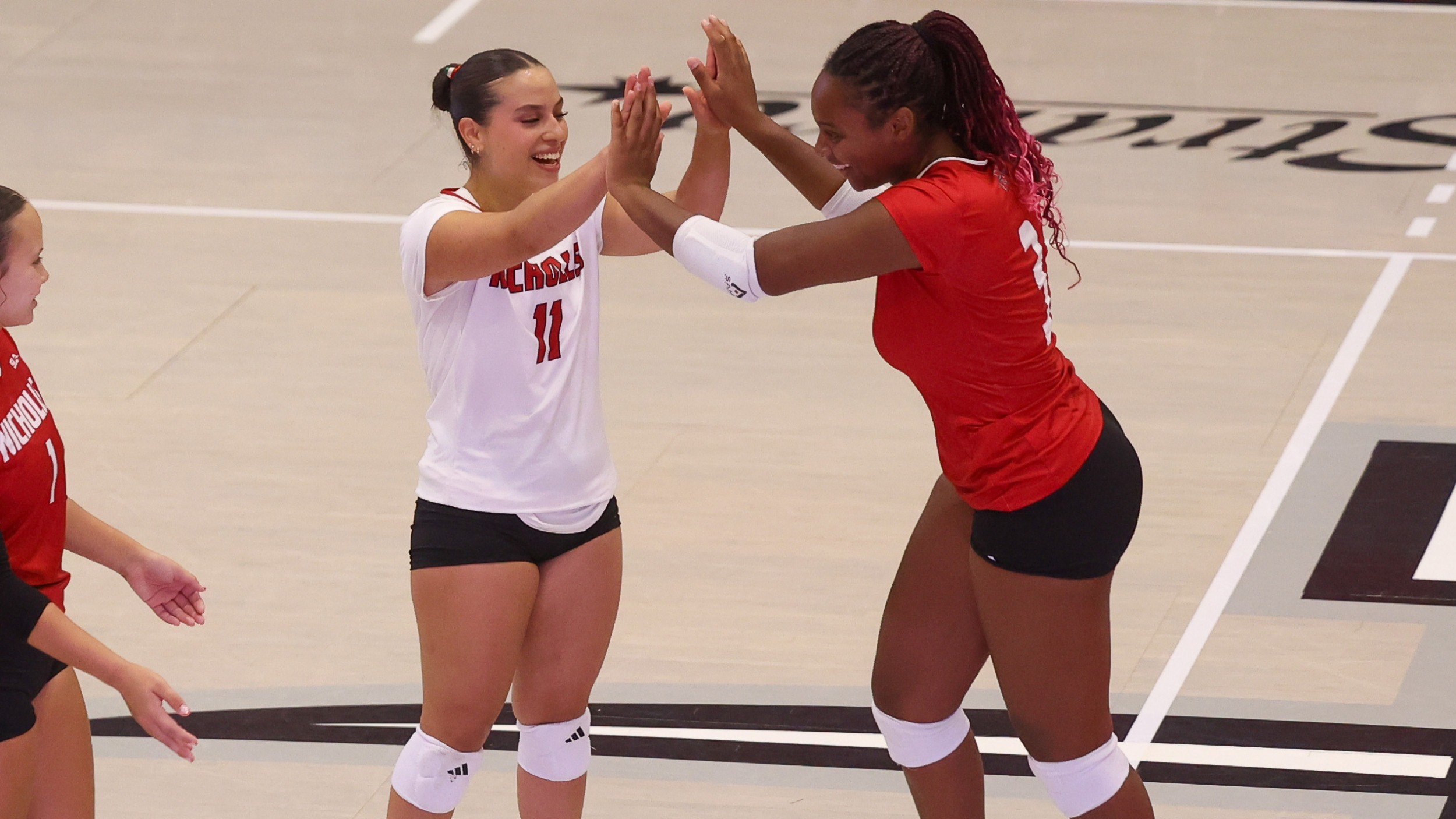 Natalia Navarro and Zahahrah Edwards-Wylie celebrate point