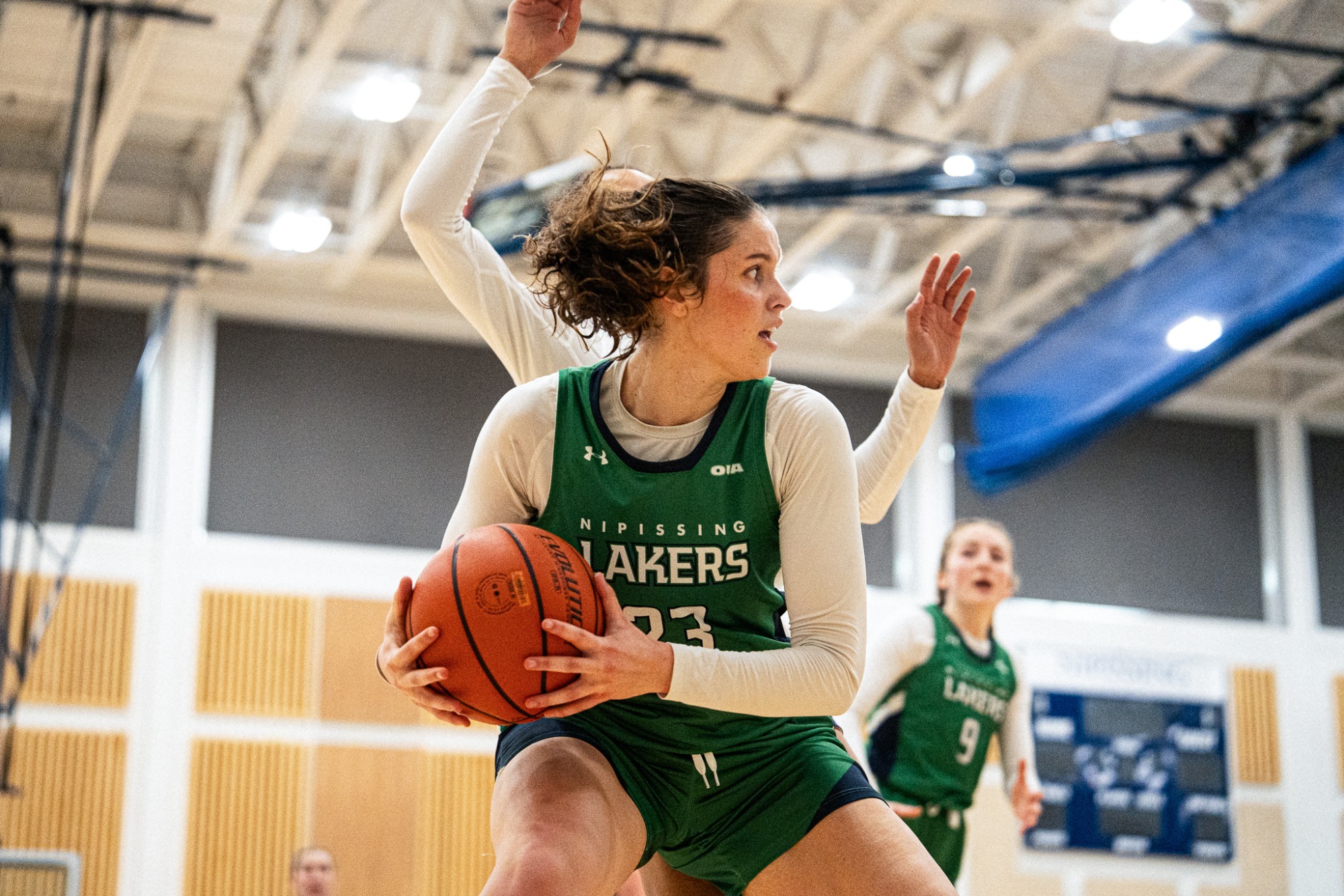 Nipissing Women's Basketball controls the ball