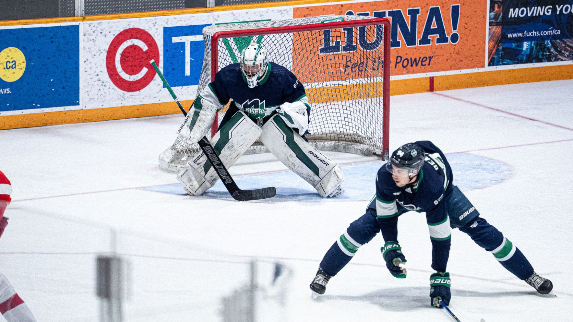 Zach Roy tracks the puck in the defensive zone