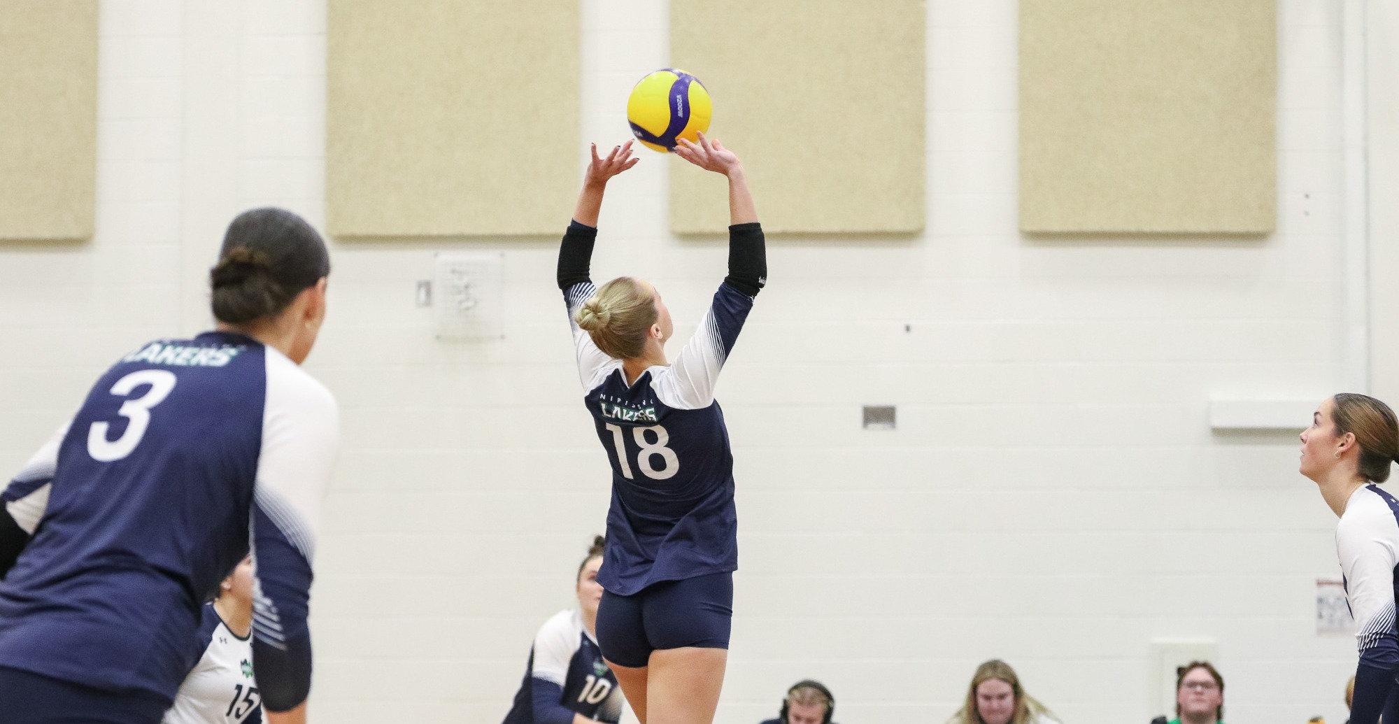 Logan Garvey sets the ball