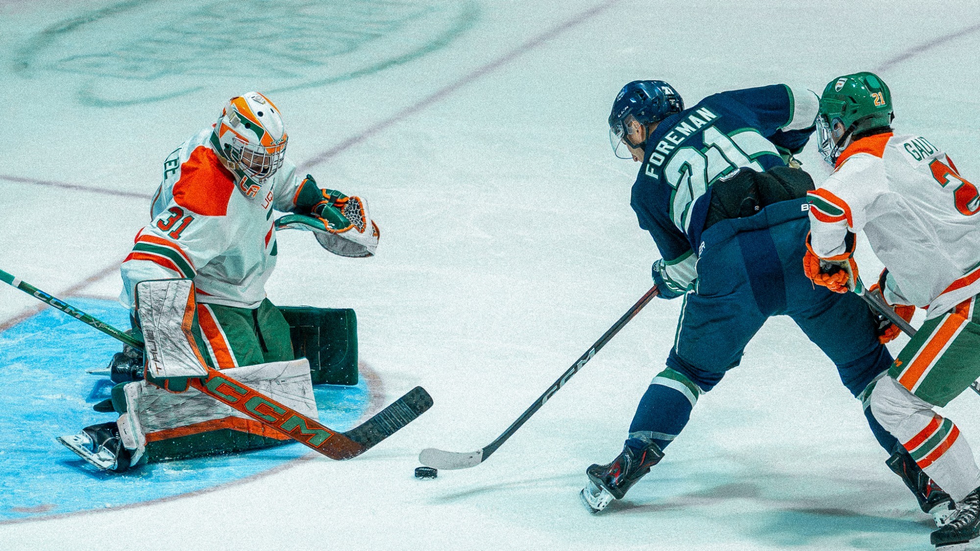 Kyle Foreman battles for the puck