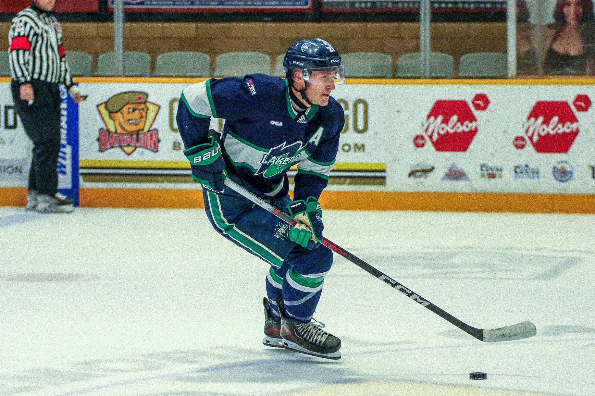 Kyle Foreman moves the puck through the neutral zone