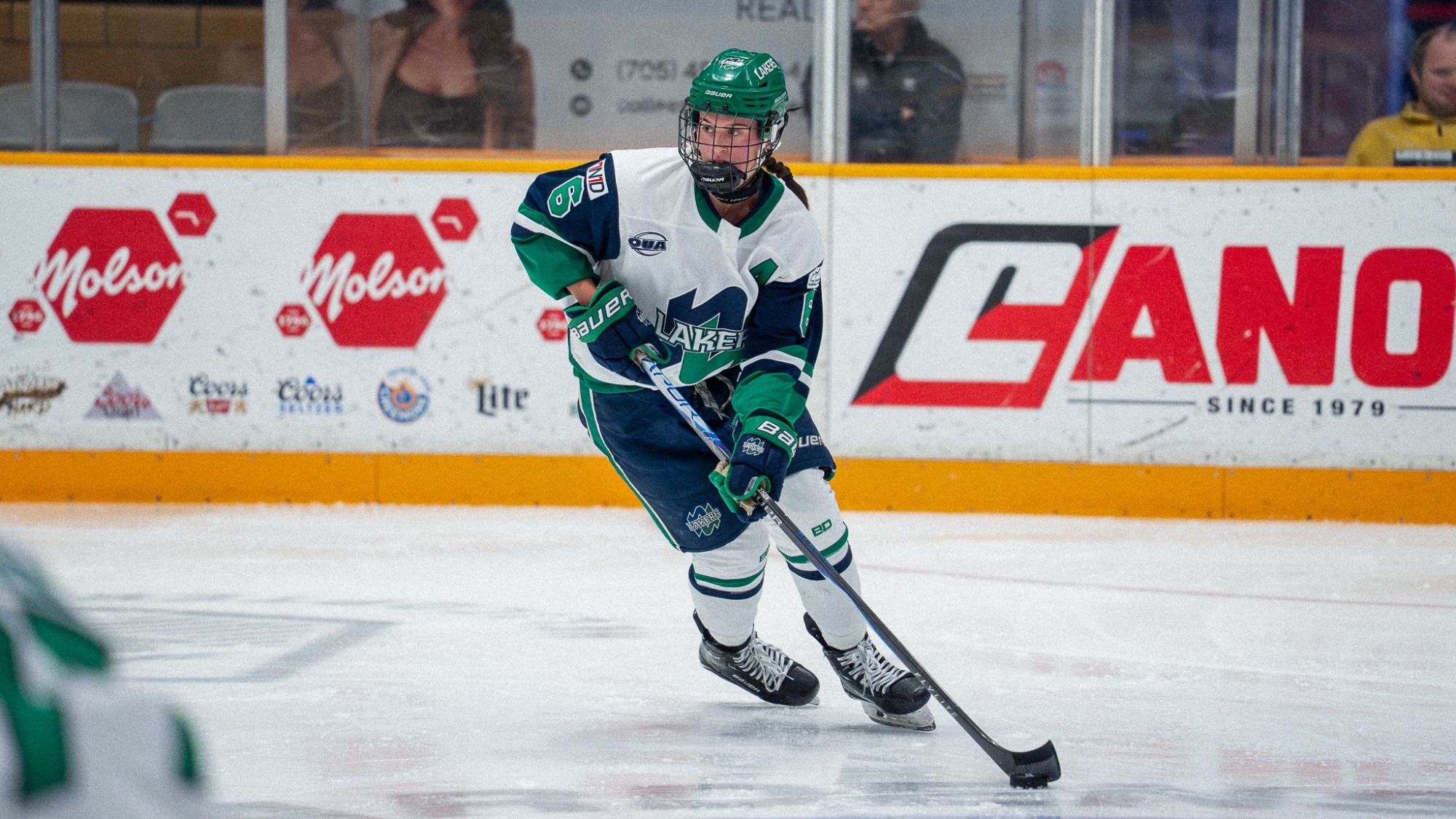Tessa Kosec carries the puck in the neutral zone