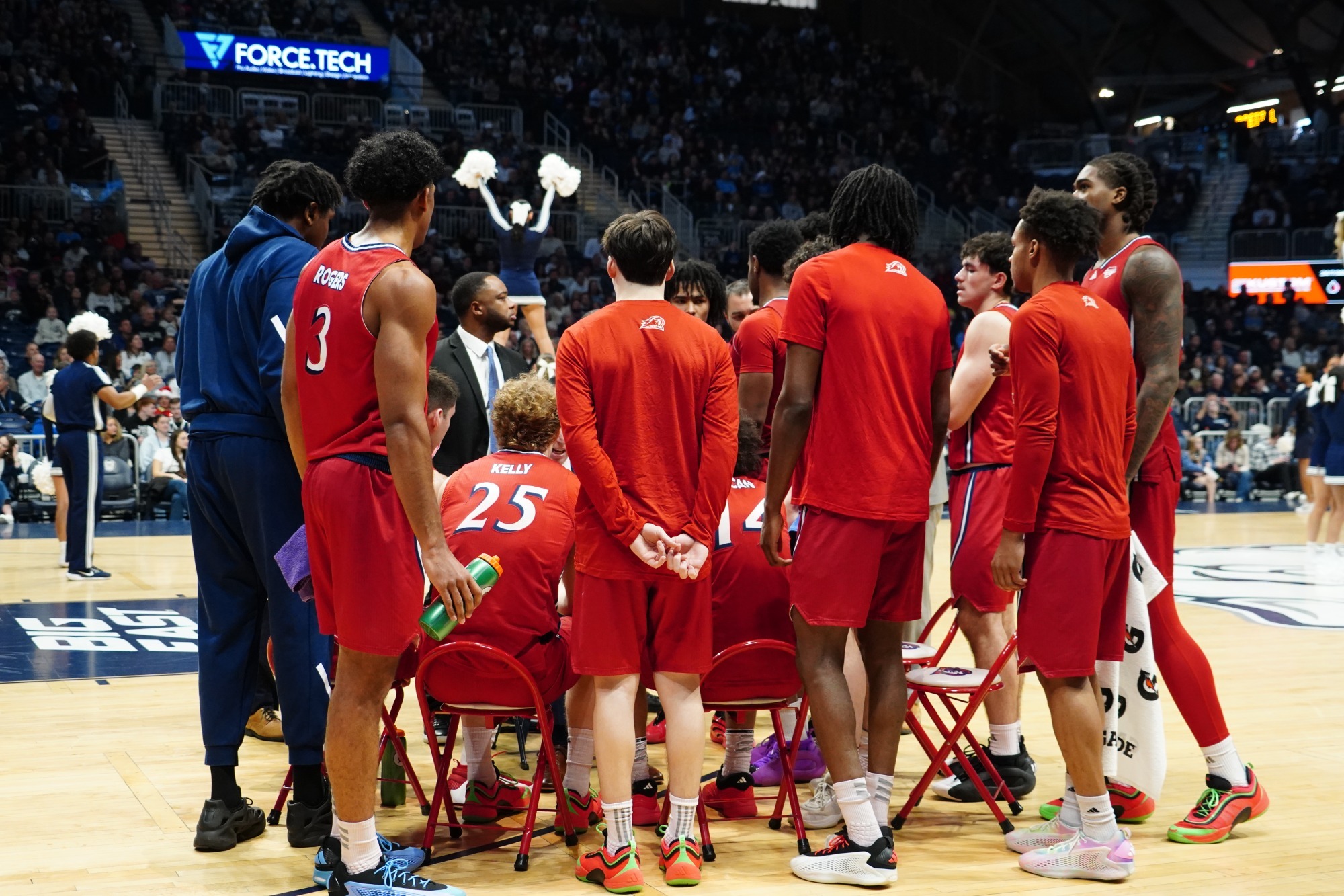 MBB bench huddle at Butler