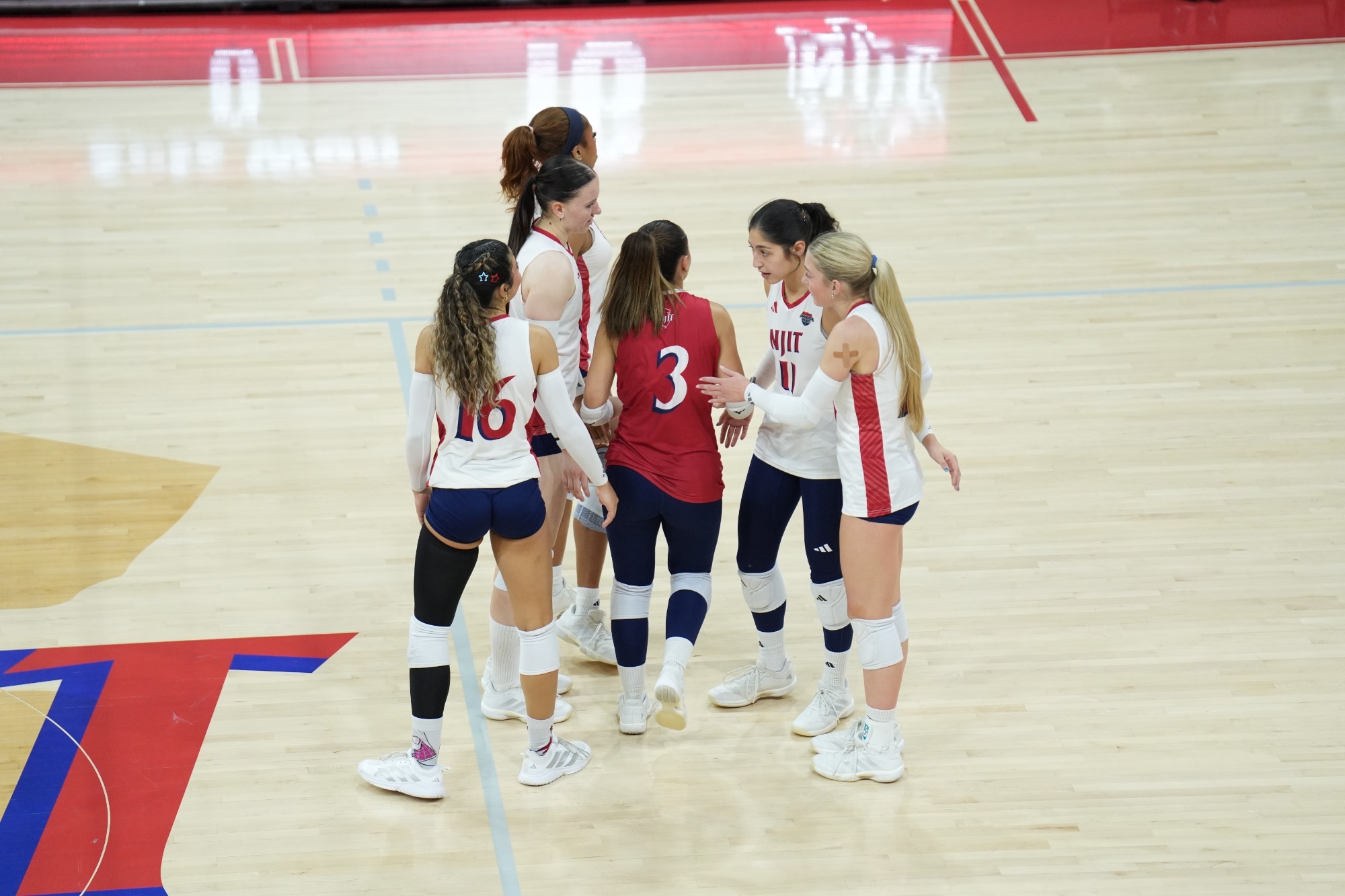 WVB team huddle vs Binghamton