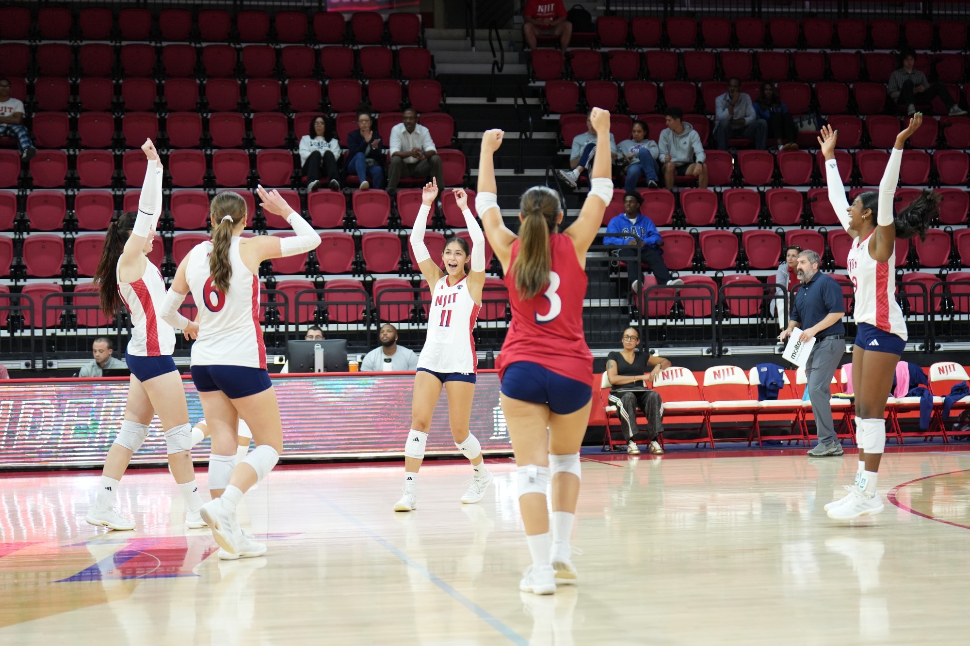WVB team celebration shot vs Manhattan