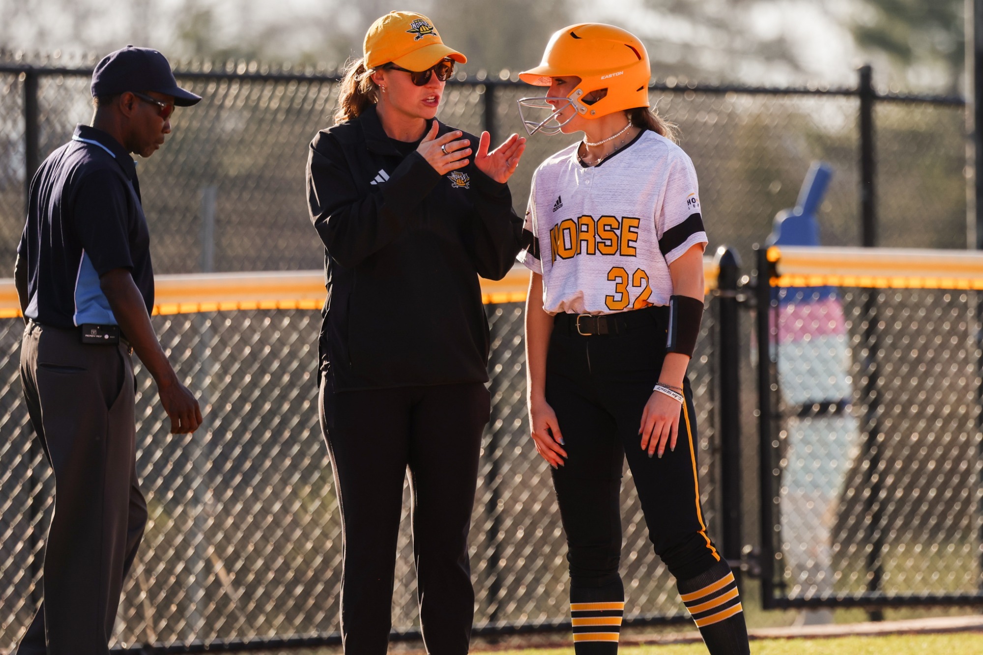 Coach Gerak giving instruction to baserunner.