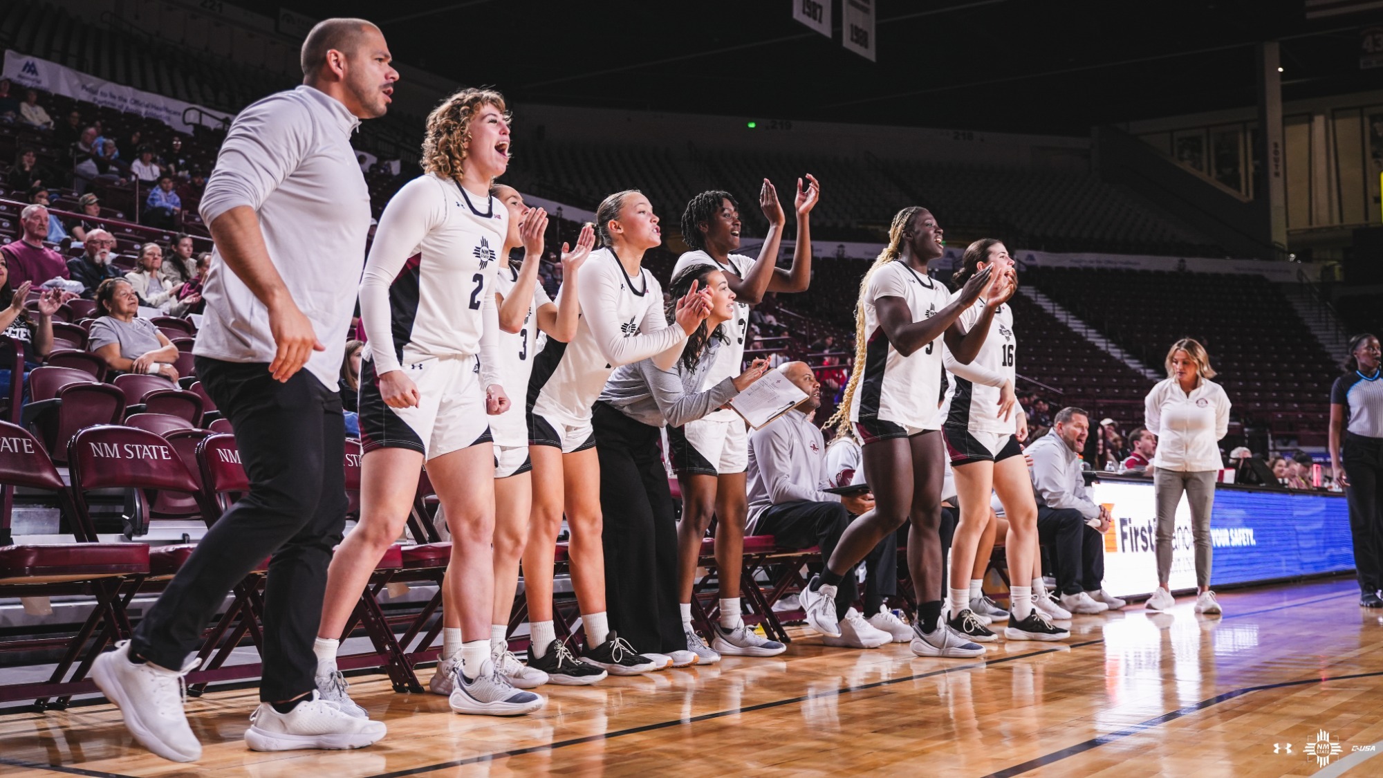 NM State bench celebrating during a win over WNMU (12/14)