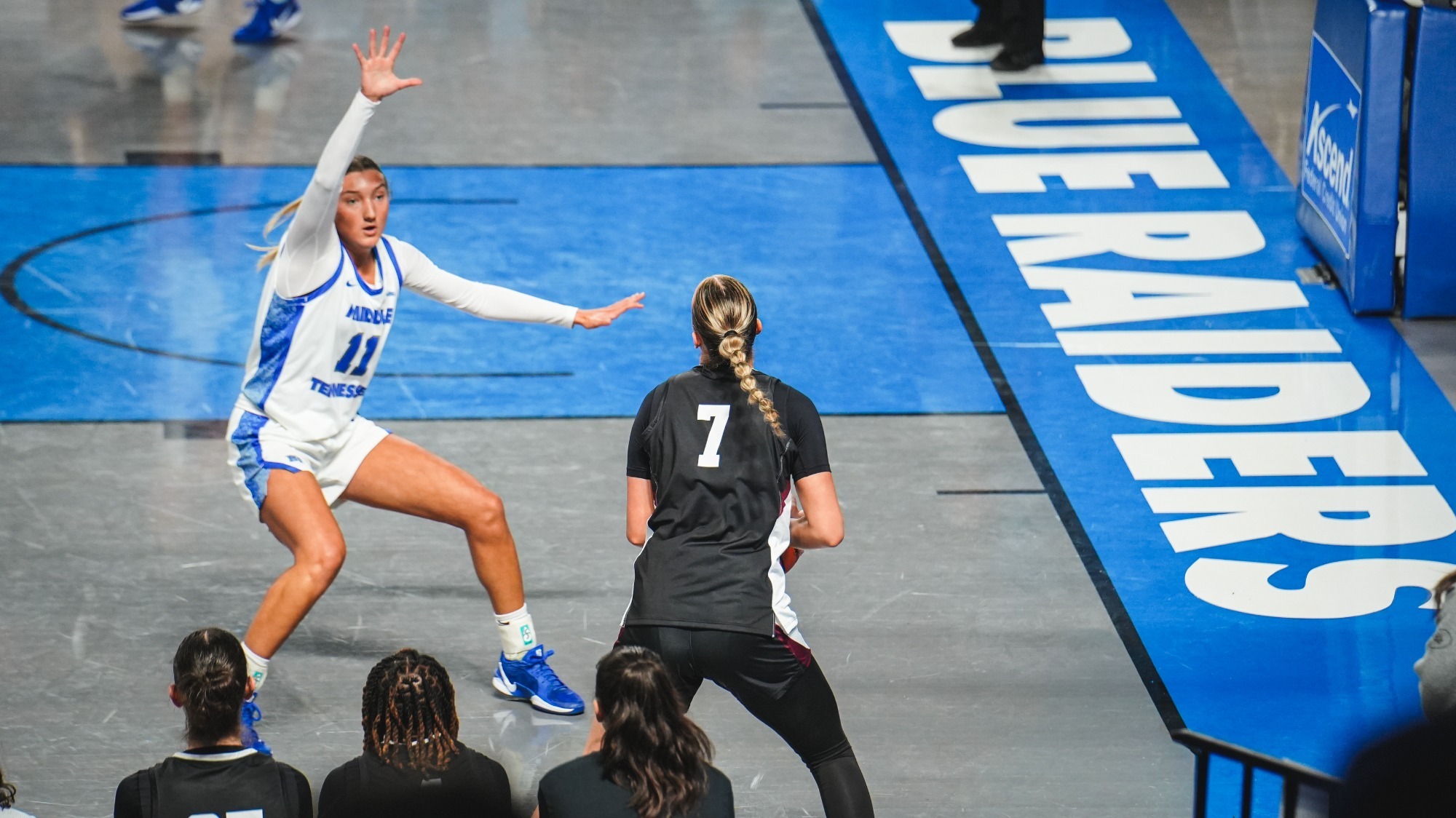 Nikki Stanic preparing to take a 3-point shot against MTSU