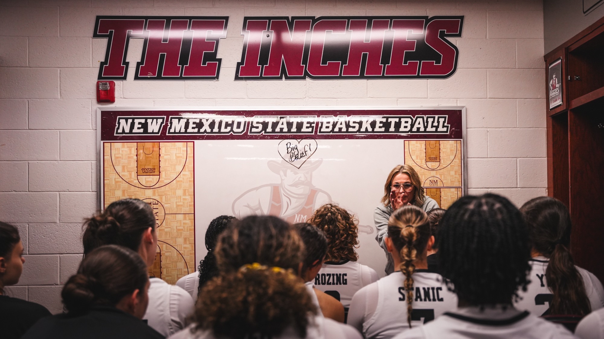 Jody Adams speaking with the team in the locker room following a win over Delaware (1/4)
