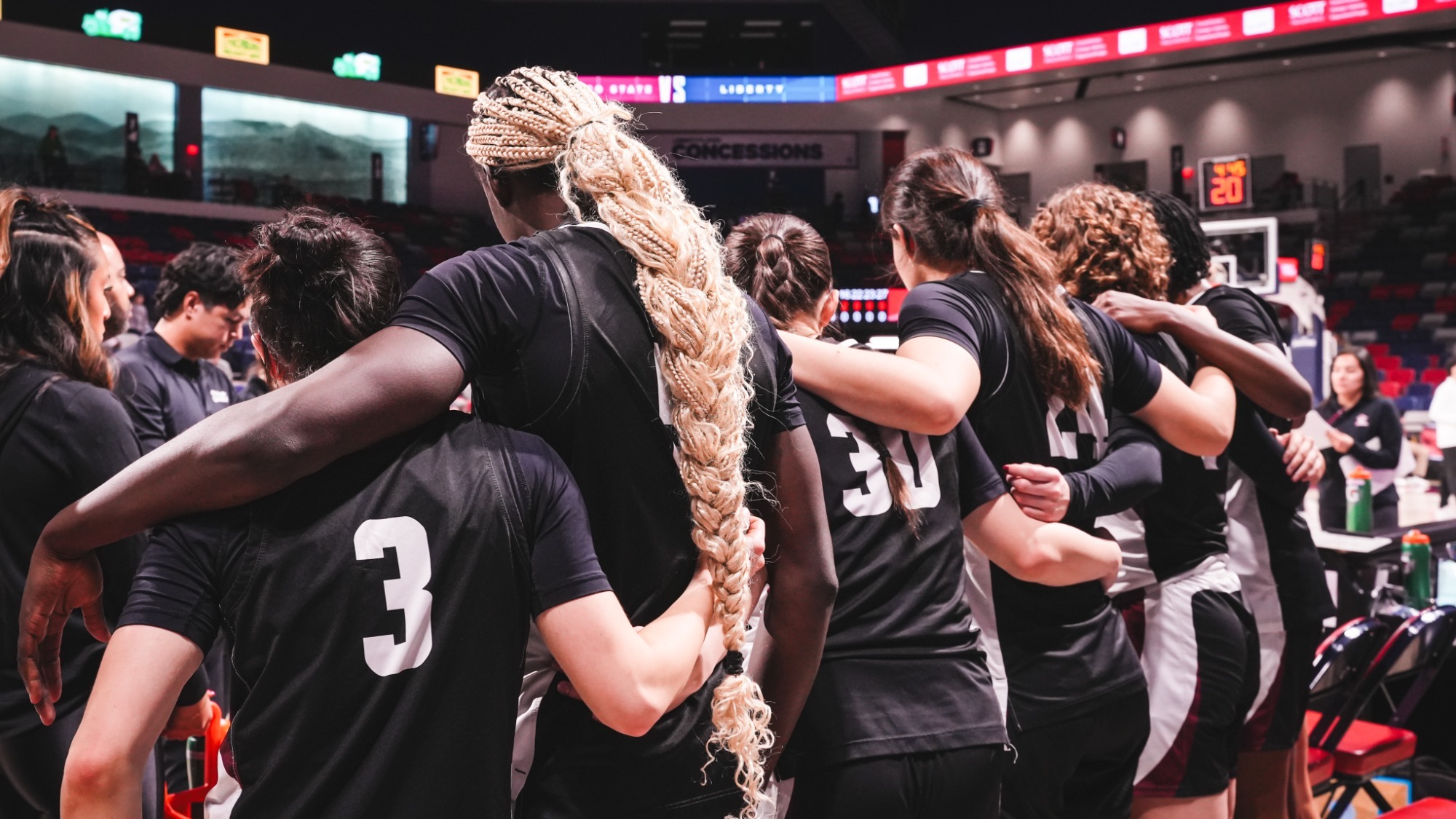 Team huddle during a contest against Liberty (2/14)