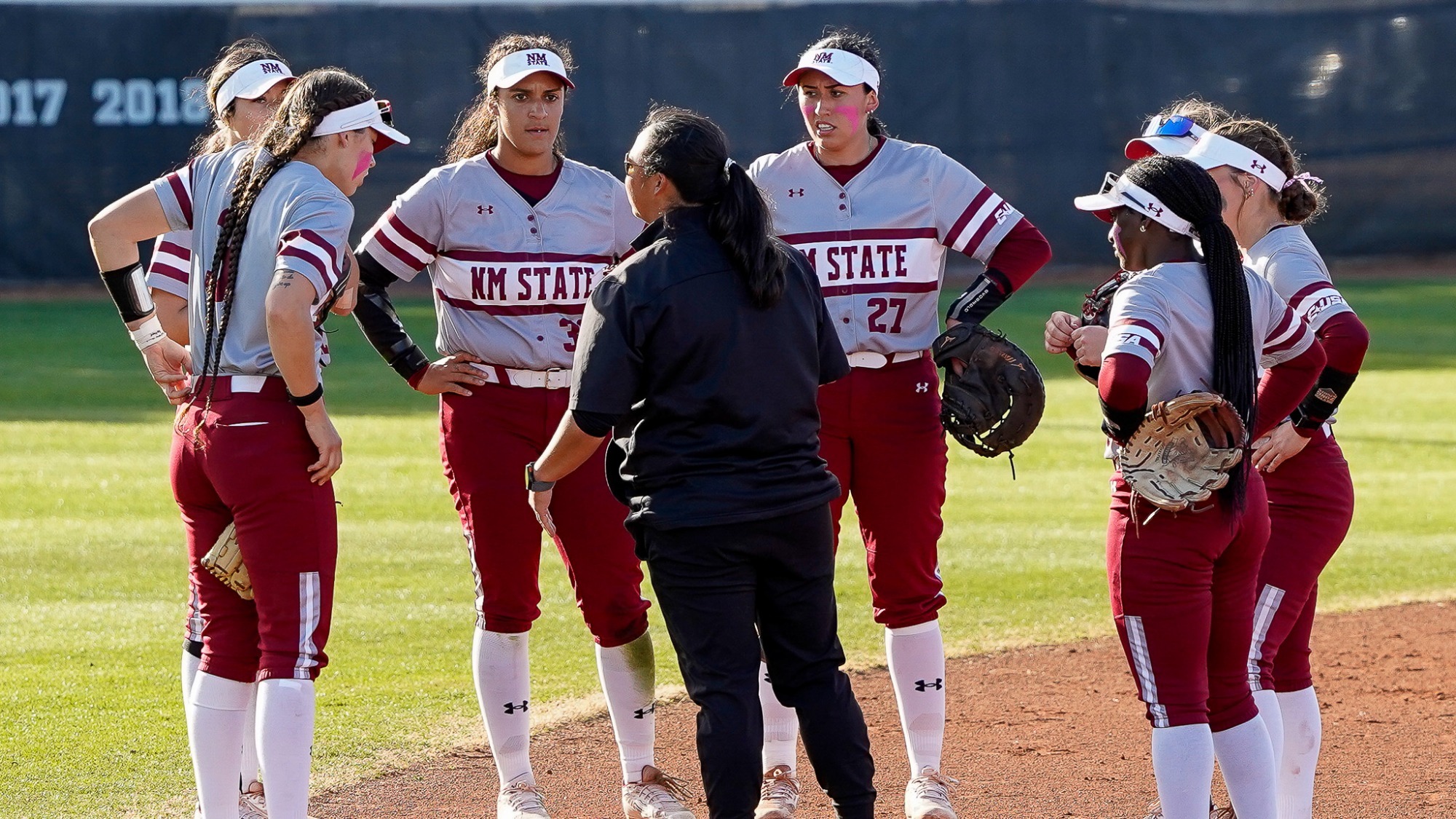 Interim Head Coach Benet Higgs talks to team.