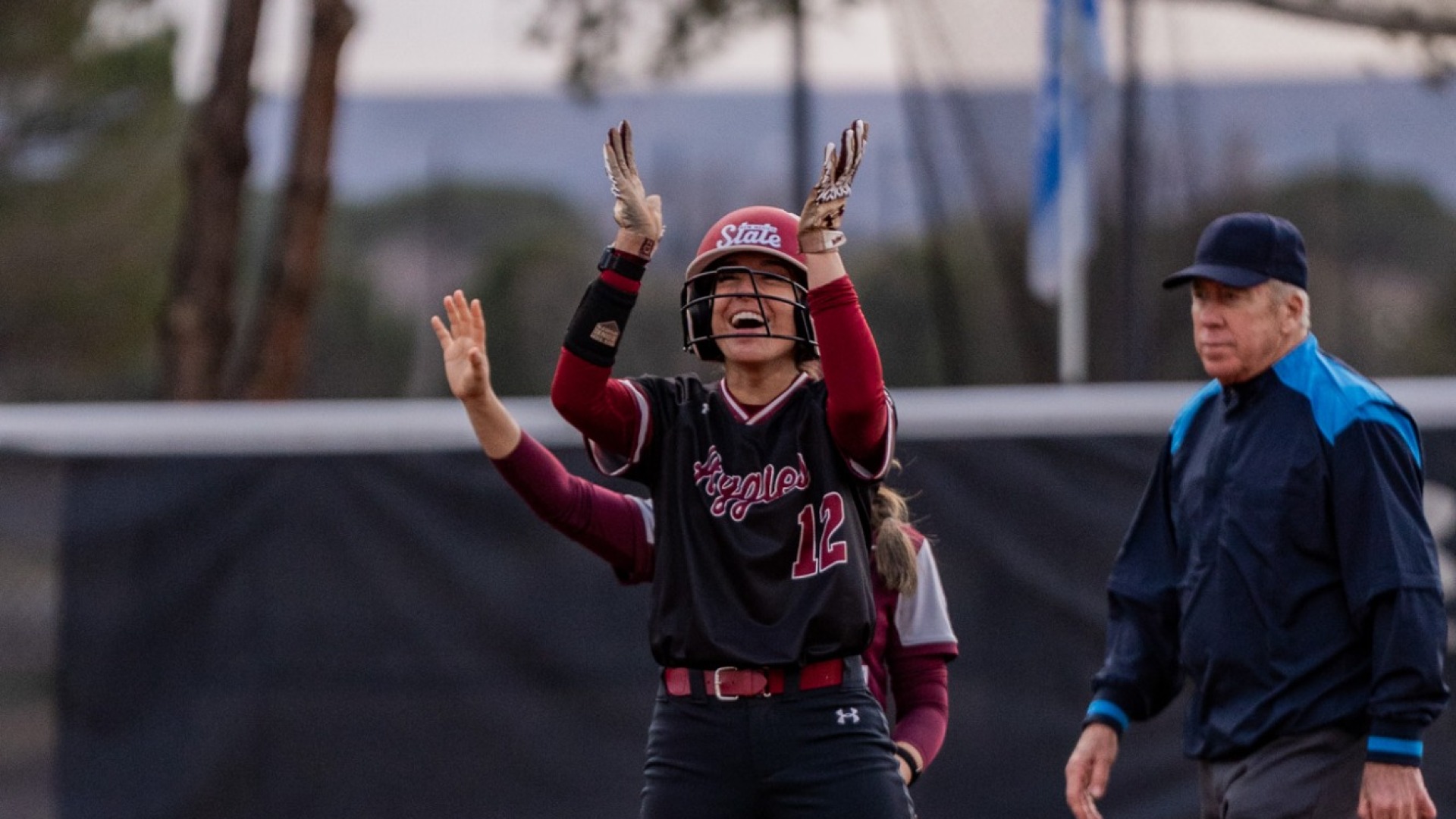 Violet Redondo celebrates on 2nd base